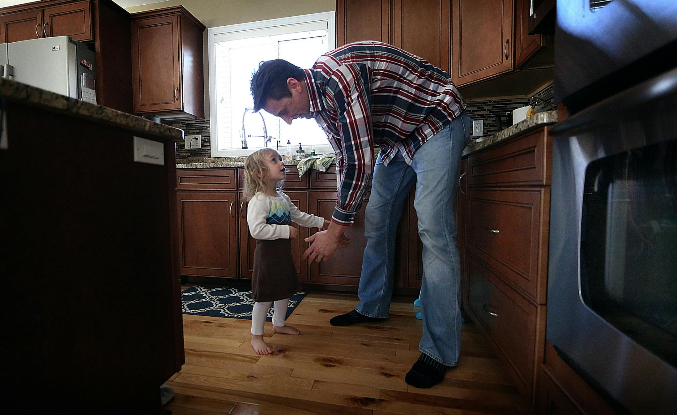 Jerrid Sebasta played with his daughter, Raiya, in the family�s home in Wilmar.
