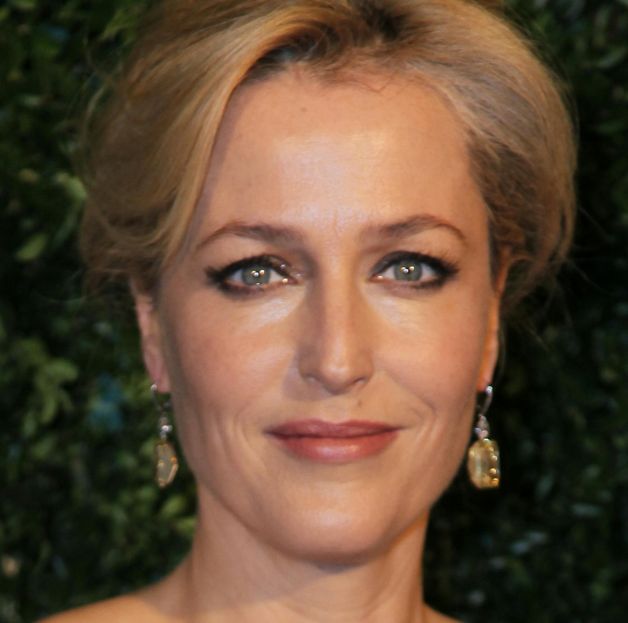 Actor Gillian Anderson poses for photographers on arrival at the Evening Standard Theatre Awards, on Sunday Nov 30, 2014 in Central London. (Photo by Grant Pollard/Invision/AP)