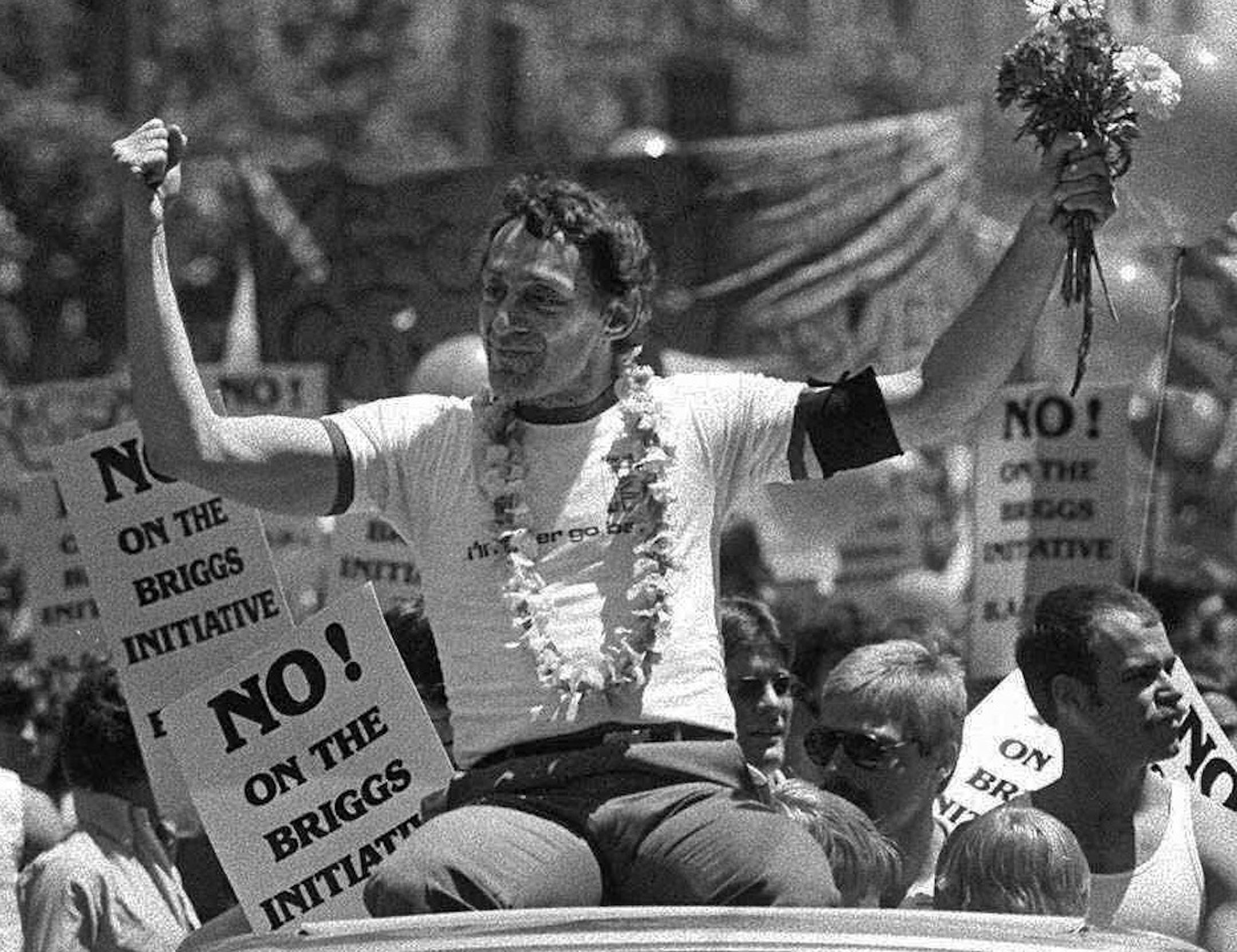 ADVANCE FOR USE SUNDAY, JUNE 9, 2013 AND THEREAFTER - FILE - In this June 26, 1978 file photo, San Francisco Supervisor Harvey Milk greets the crowd as he rides in a convertible in San Francisco's seventh annual gay freedom parade. Milk became one of the first openly gay men elected to public office in the United States when he won a seat on the board of supervisors in 1977, inspiring a generation of activists with his uncompromising call for gays to come out. (AP Photo/File) ORG XMIT: NY941
