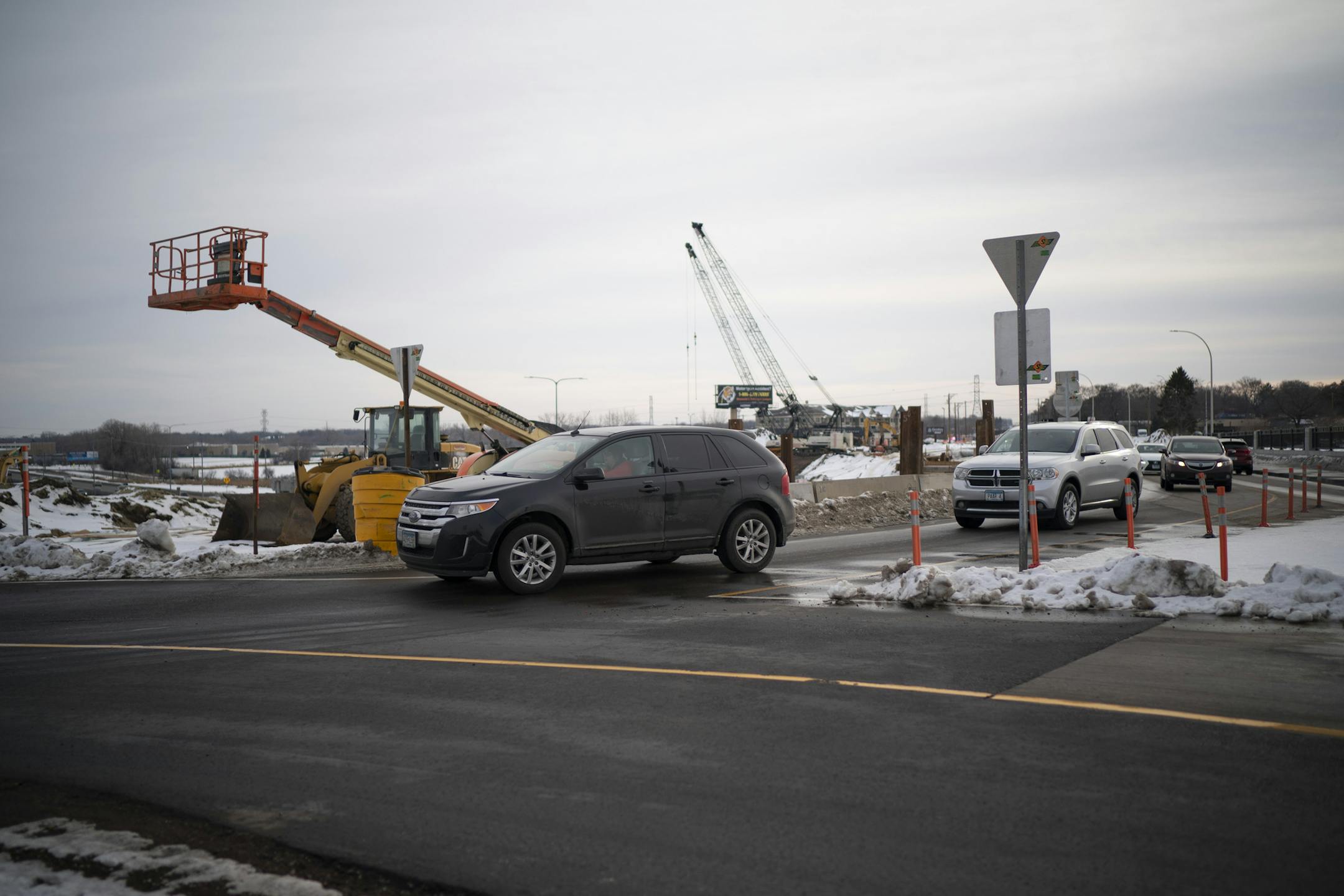 Cars entering the first completed roundabout that is part of the reconstruction project on the Rice St. bridge over I-694. ] JEFF WHEELER • Jeff.Wheeler@startribune.com A $23 million reconstruction of the Rice St. bridge over I-694 that includes three roundabouts will mean smoother travels for the 18,000 motorists who pass through there everyday. Bicyclists and walkers will now have safer passage with trails on both sides of the new bridge. The construction was photographed Monday afterno