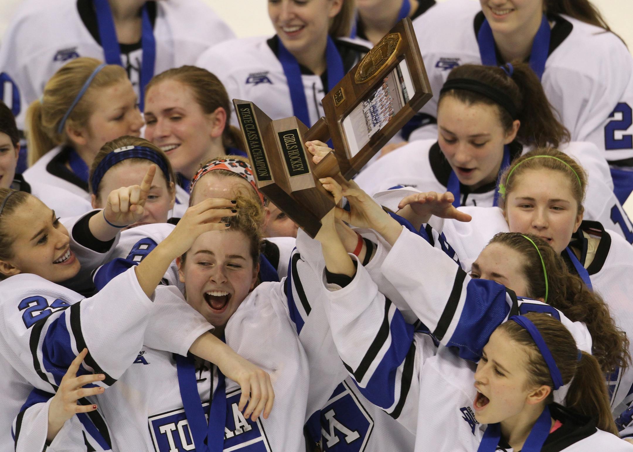 Girls State Hockey Tournament, Class AA Championship, Minnetonka vs. Roseville. 2/25/12. (left to right) Minnetonka celebrated their win over Roseville for the Class 2A championship.