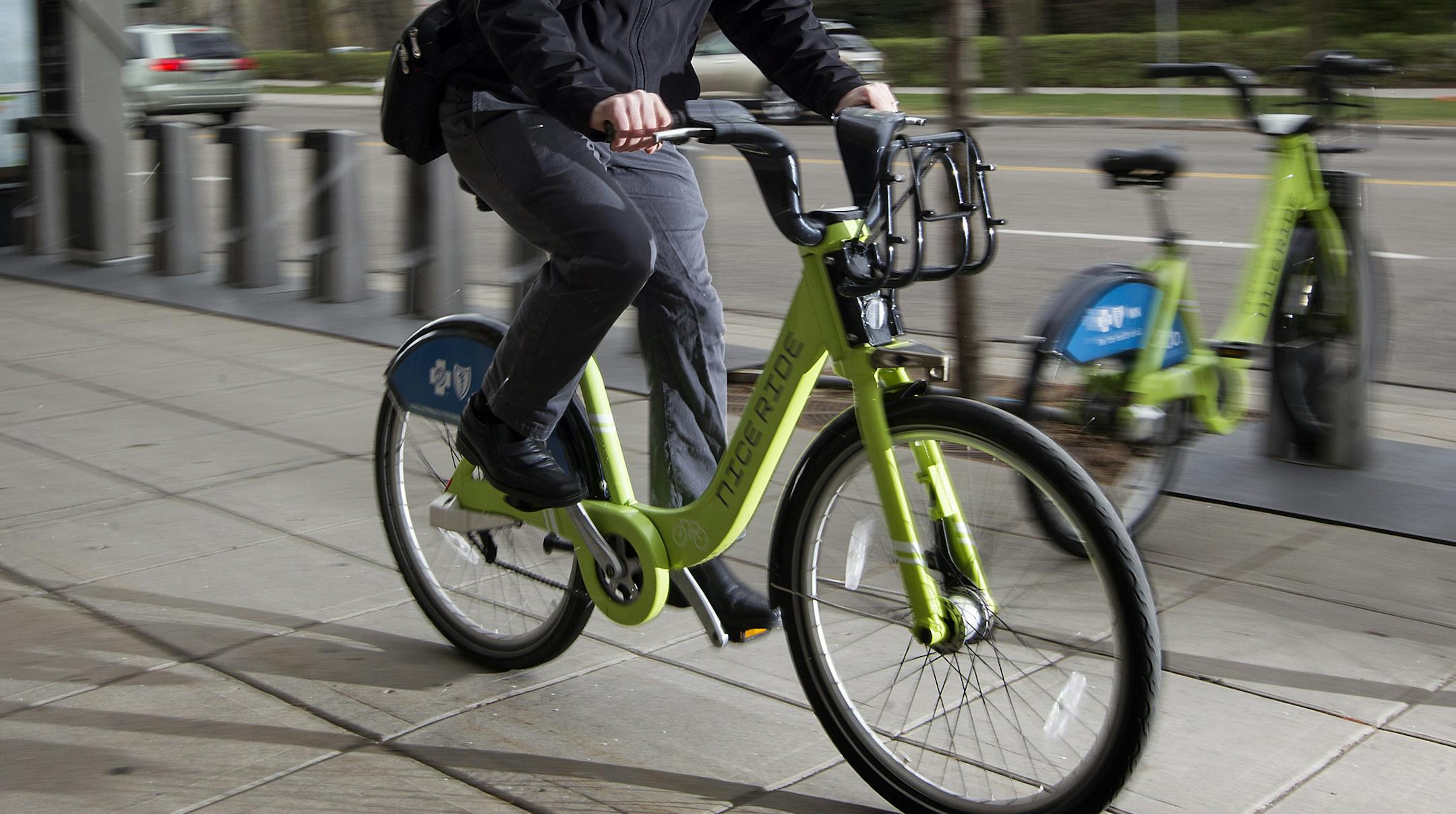 Ed Kohler uses Nice Ride bicycles to get around town. Photographed on East Lake Street in Minneapolis April 21, 2015. (Courtney Perry)