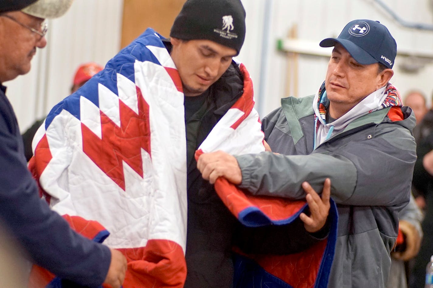 Standing Rock Sioux Tribal Chairman David Archambault gave a blanket to Chris Turley, an Osage veteran who walked from Oklahoma to Fort Yates, N.D., to support the protesters.