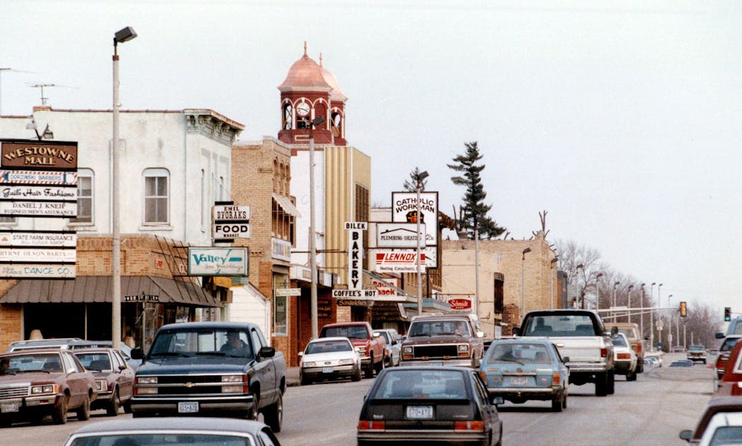 St. Wenceslaus Catholic Church rises behind downtown New Prague in 1990.