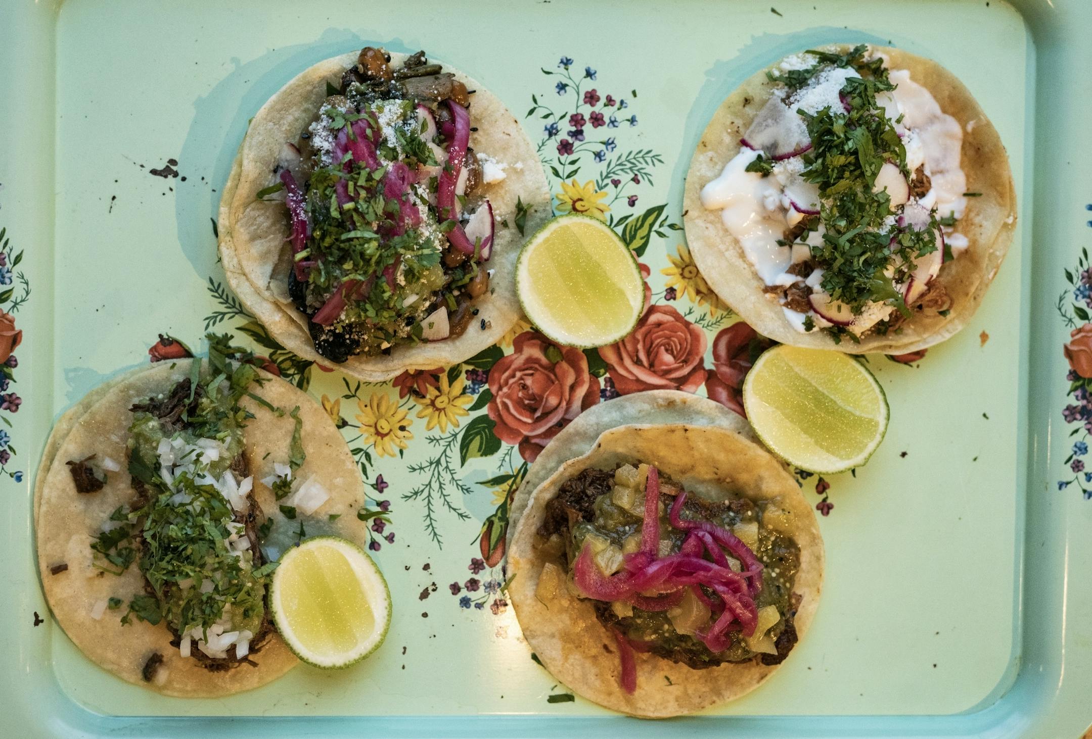 Clockwise(top left to bottom left) nopales, tinga, carnitas en adobo, and barbacoa, .