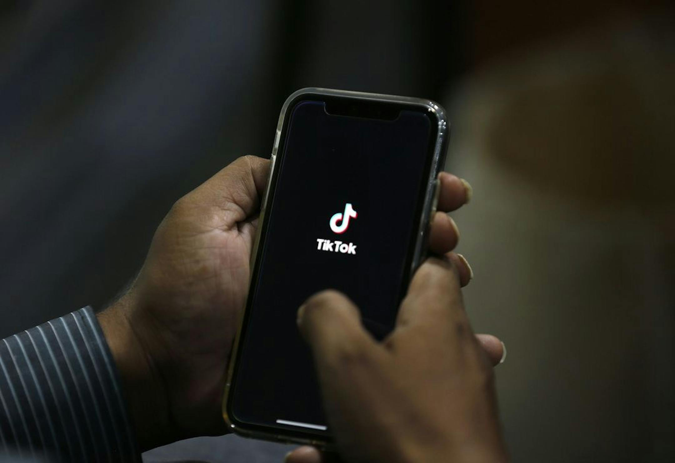 A man opened social media app TikTok on his cell phone, in Islamabad, Pakistan, in July.