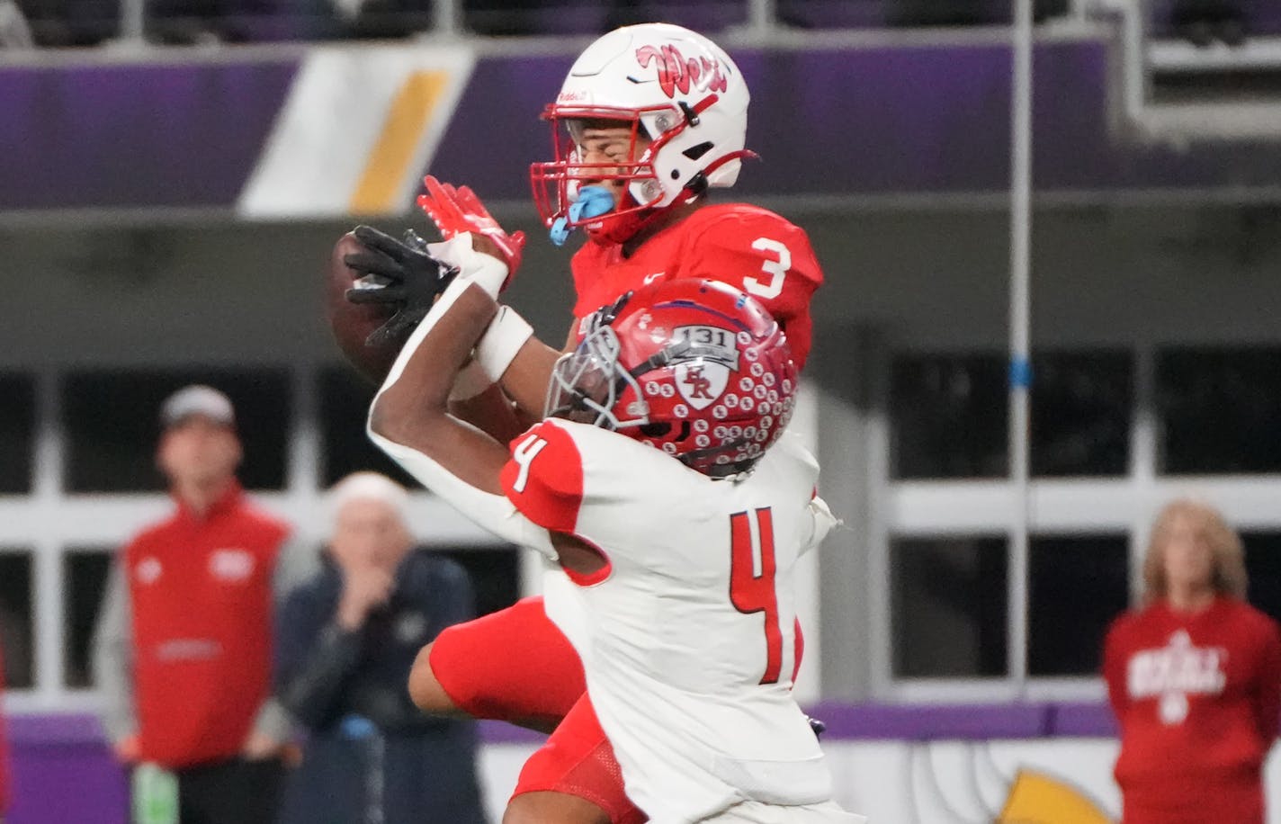 Mankato West's Jalen Smith (3) makes a catch while defended by Elk River's Darioh Balisidya (4) in the first half of the Minnesota High School football Class 5A State Championship at U.S. Bank Stadium in Minneapolis, Minn., on Saturday, Dec. 3, 2022. ] SHARI L. GROSS • shari.gross@startribune.com