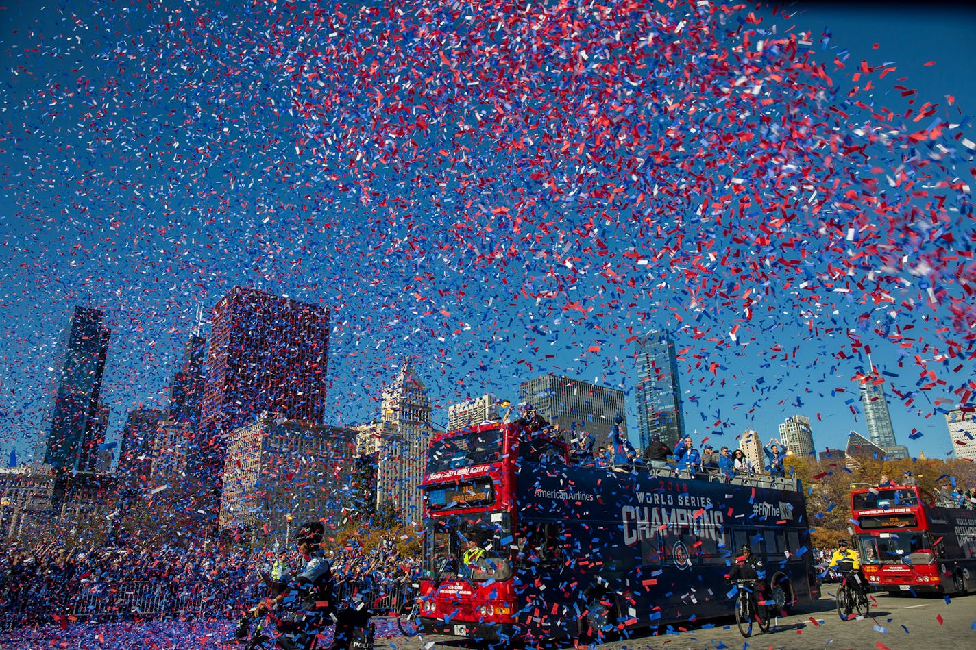 Fans celebrate the World Series champion Chicago Cubs during a parade and a rally in Grant Park in Chicago on Friday, Nov. 4, 2016.