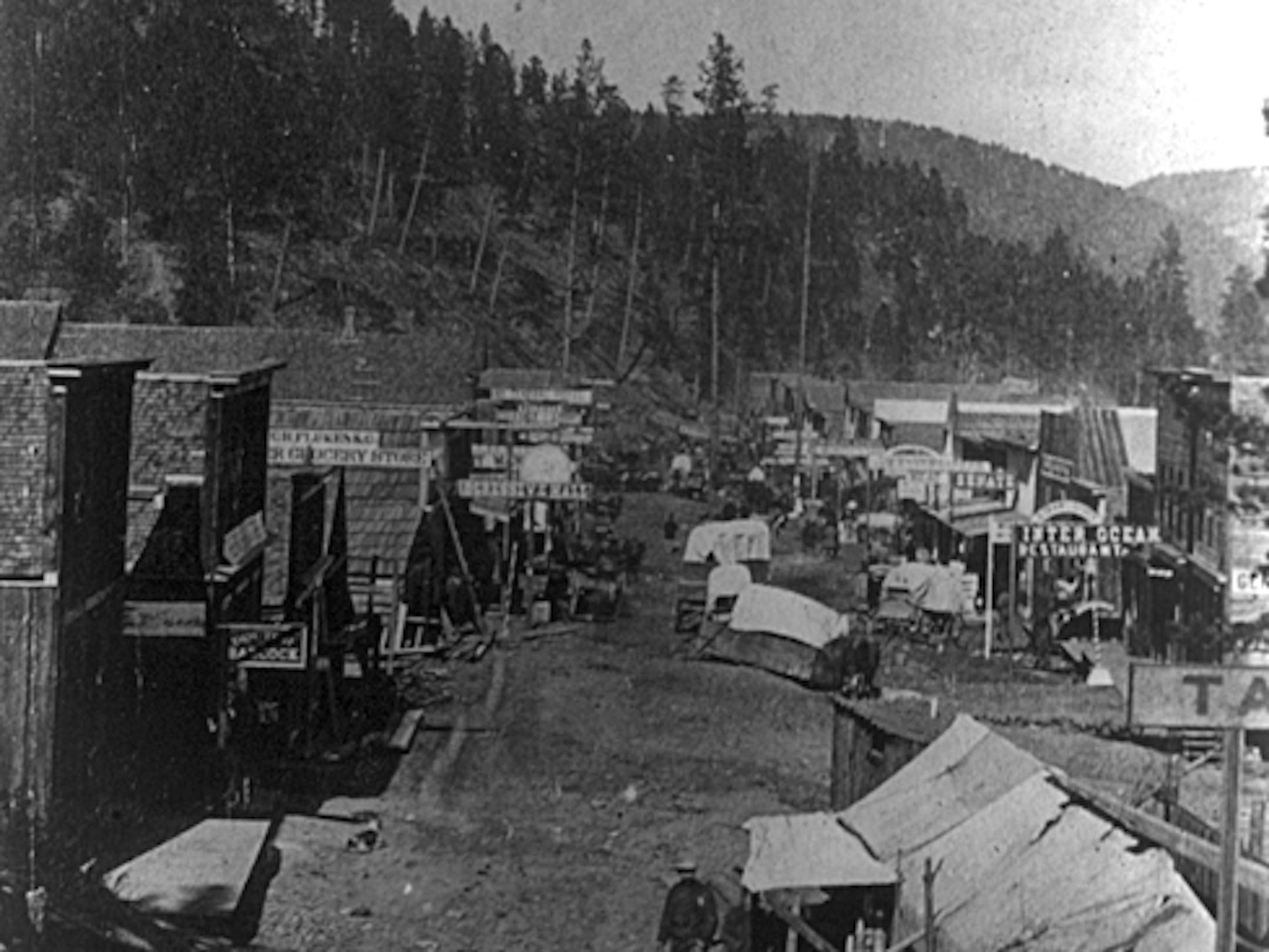 Deadwood in 1876: "Its one street runs up and down the gulch, making the same number of twists and turns the gulch does, and narrows and widens with the gulch, so that at some places it is wide enough to be almost respectable while at others it is so narrow that it will barely admit a team and wagon."