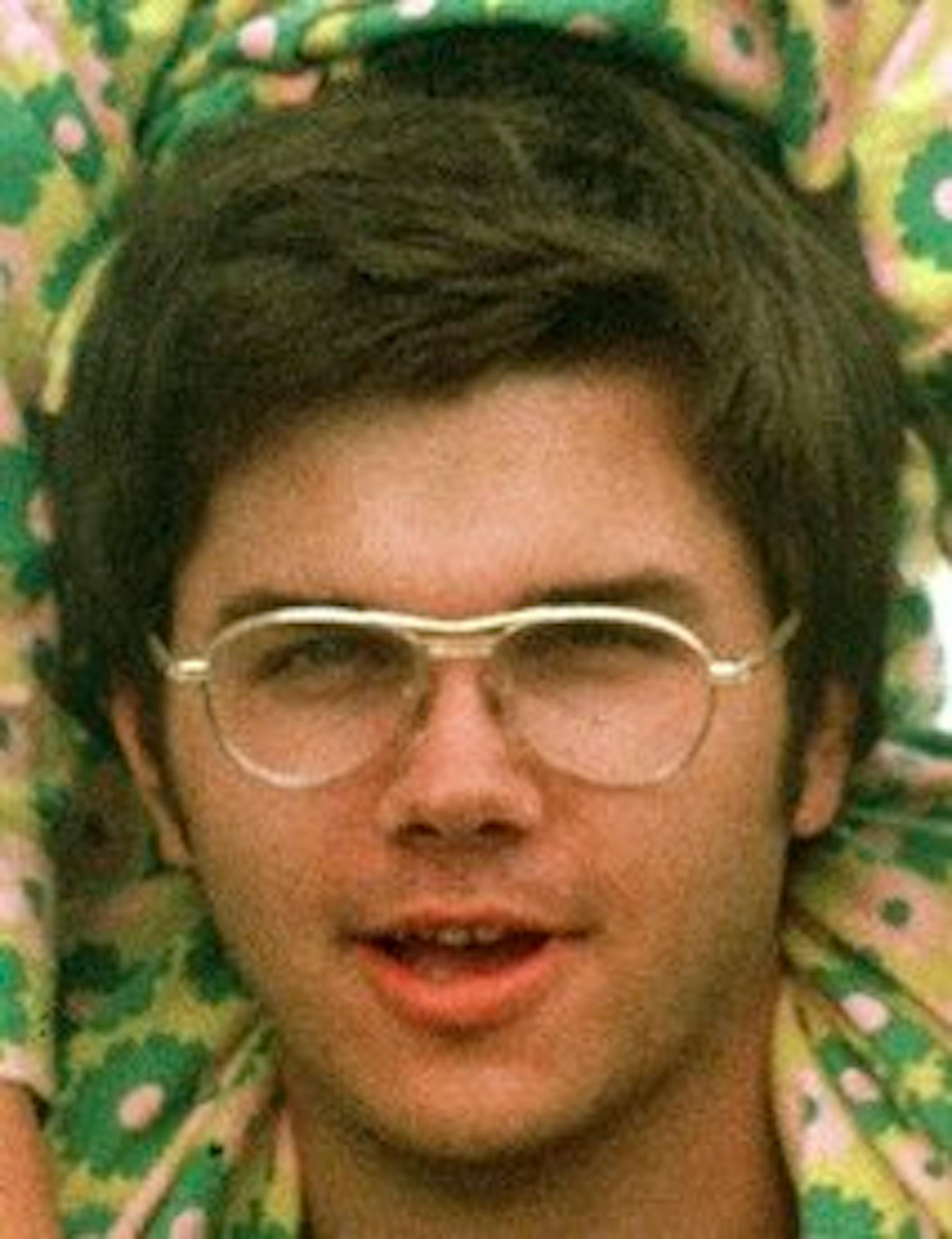 FILE - In this 1975 file photo, Mark David Chapman is seen at Fort Chaffee near Fort Smith, Ark. The man who shot John Lennon says he considered killing Johnny Carson and Elizabeth Taylor, but the ex-Beatle was more accessible. He also said that the bullets he used came from a former police officer friend. Chapman was denied parole after the Sept. 7 hearing, his sixth since becoming eligible in 2000. He will be up again in 2012. (AP Photo/Greg Lyuan, File)