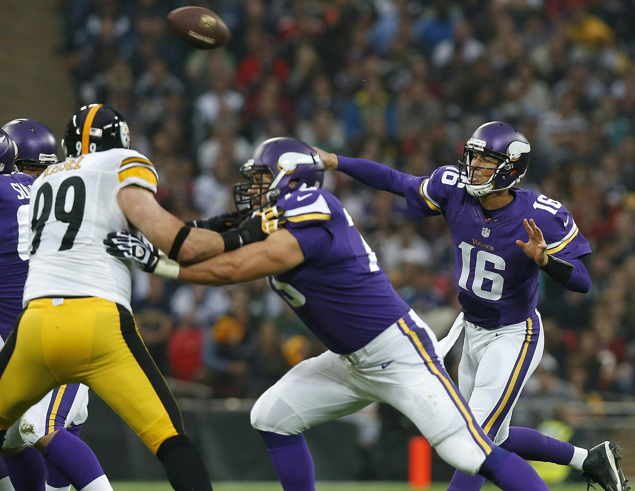 Minnesota Vikings quarterback Matt Cassel , right, passes the ball during the NFL football game against Pittsburgh Steelers at Wembley Stadium, London , Sunday, Sept. 29, 2013. (AP Photo/Sang Tan) ORG XMIT: TH110