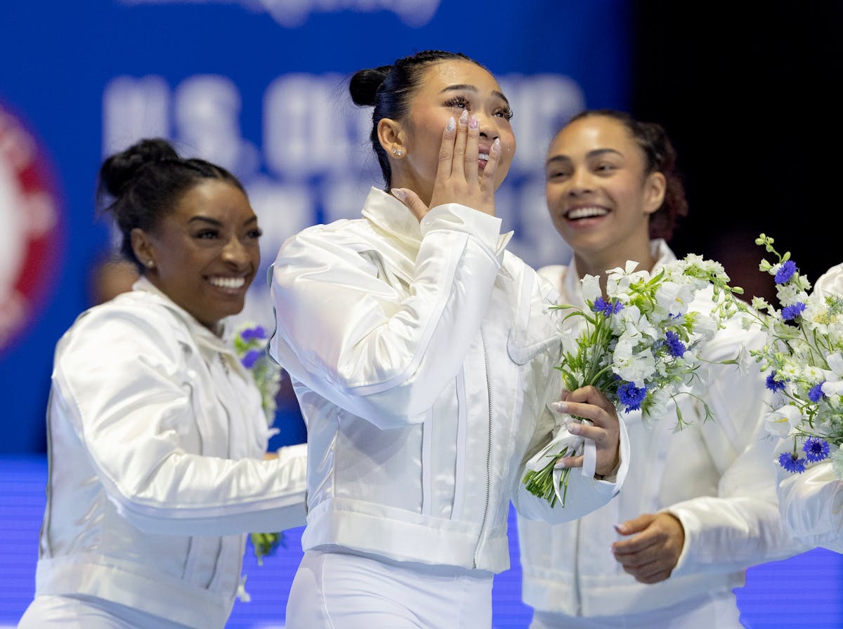 Suni Lee of St. Paul celebrates with teammates after being introduced as a member of the U.S. Olympic team in women's gymnastics at Target Center on J