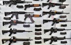 FILE - In this July 20, 2014 file photo, guns are displayed for sale by an arms seller east of Colorado Springs, Colo. The U.S. is among wealthy count