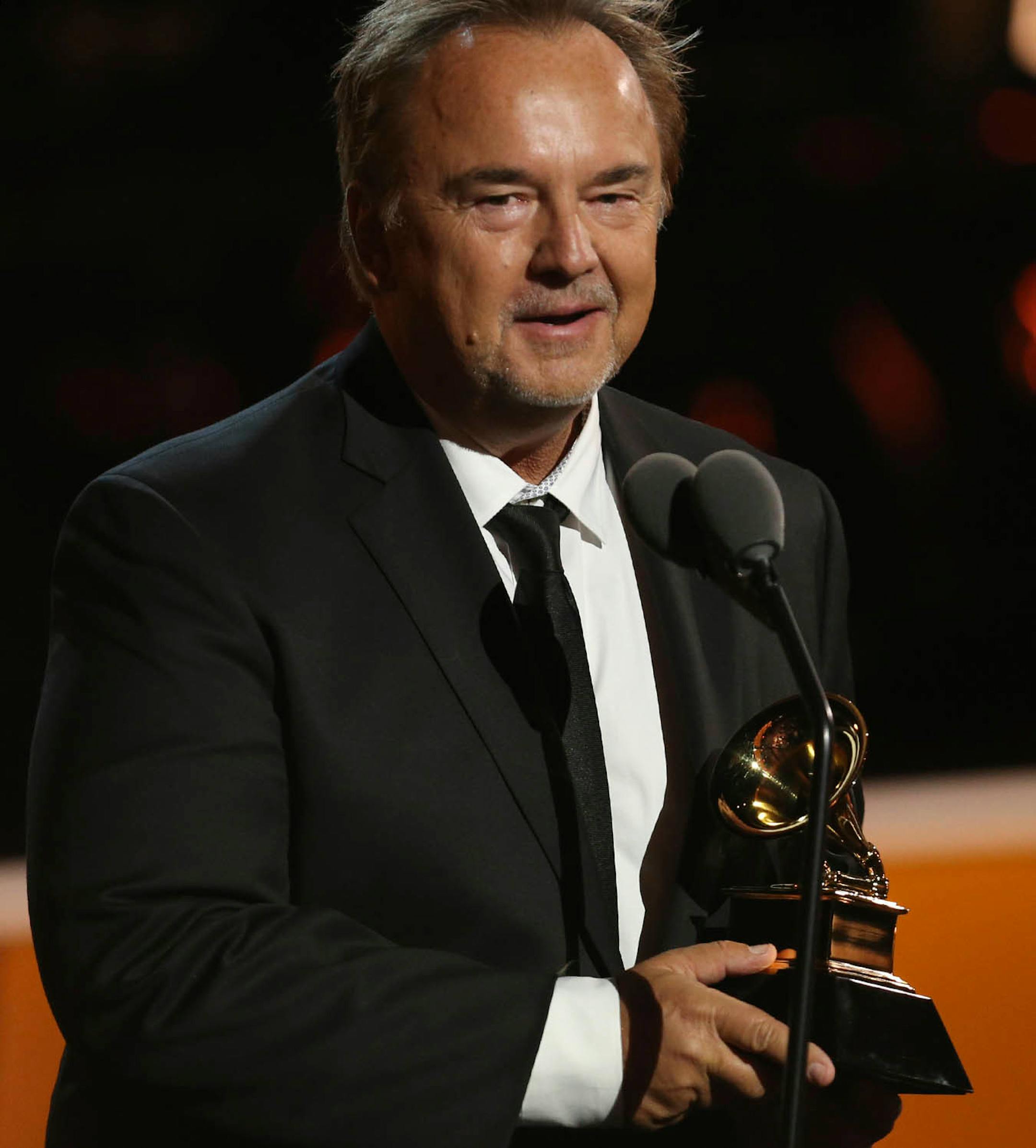 Peter Kater accepts the best new age album award for "Dancing On Water" at the 60th annual Grammy Awards at Madison Square Garden on Sunday, Jan. 28, 2018, in New York.