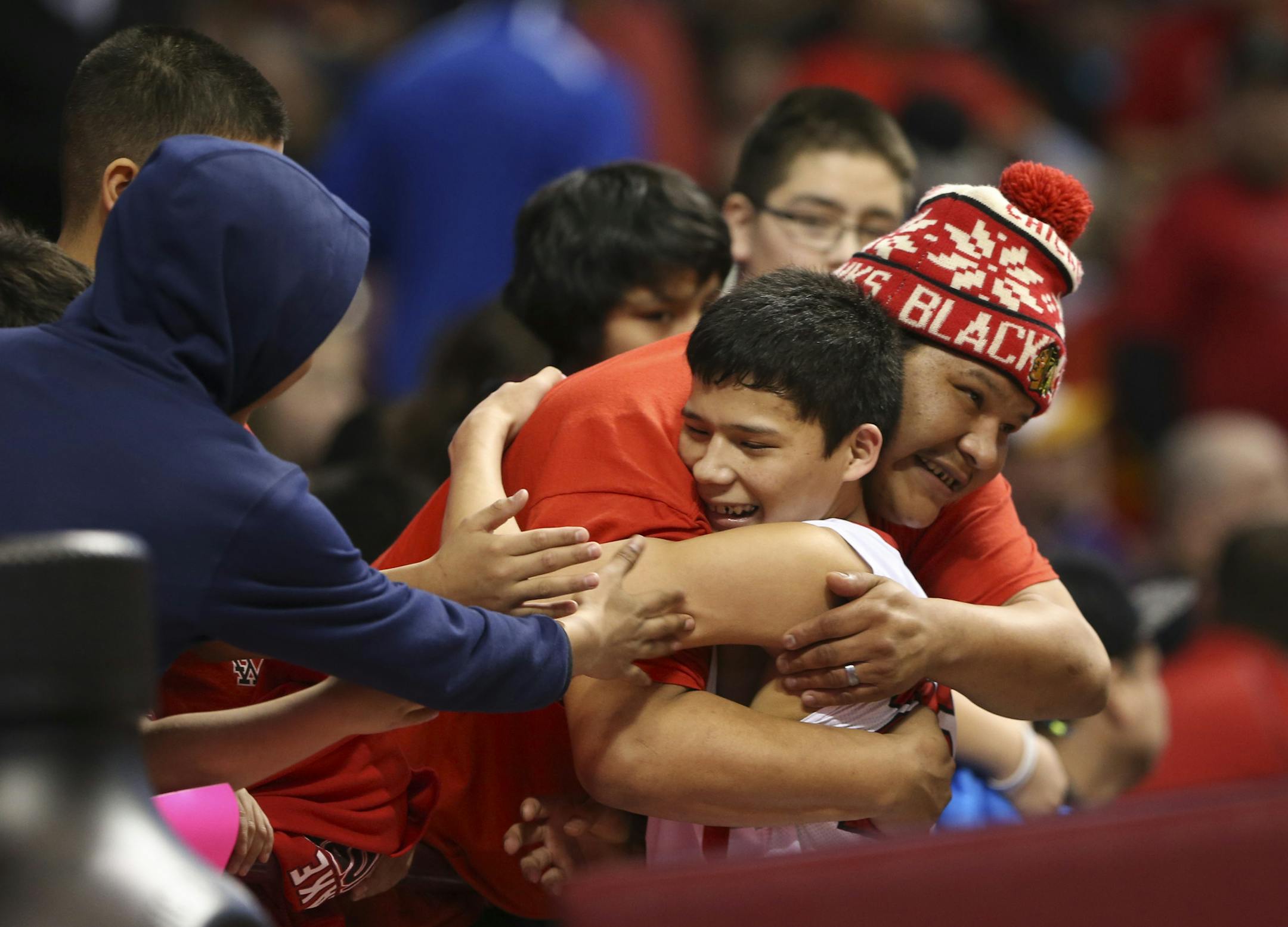 Kendall Whitefeather got a hug from his big brother, Corey Whitefeather, after the Red Lake Warriors defeated Browerville 66-52 Thursday afternoon in Class A basketball action. ] JEFF WHEELER ï jeff.wheeler@startribune.com Red Lake beat Browerville 66-52 in a Boys' State Basketball Tournament Class A quarterfinal game Thursday afternoon, March 910, 2016 at Williams Arena in Minneapolis.