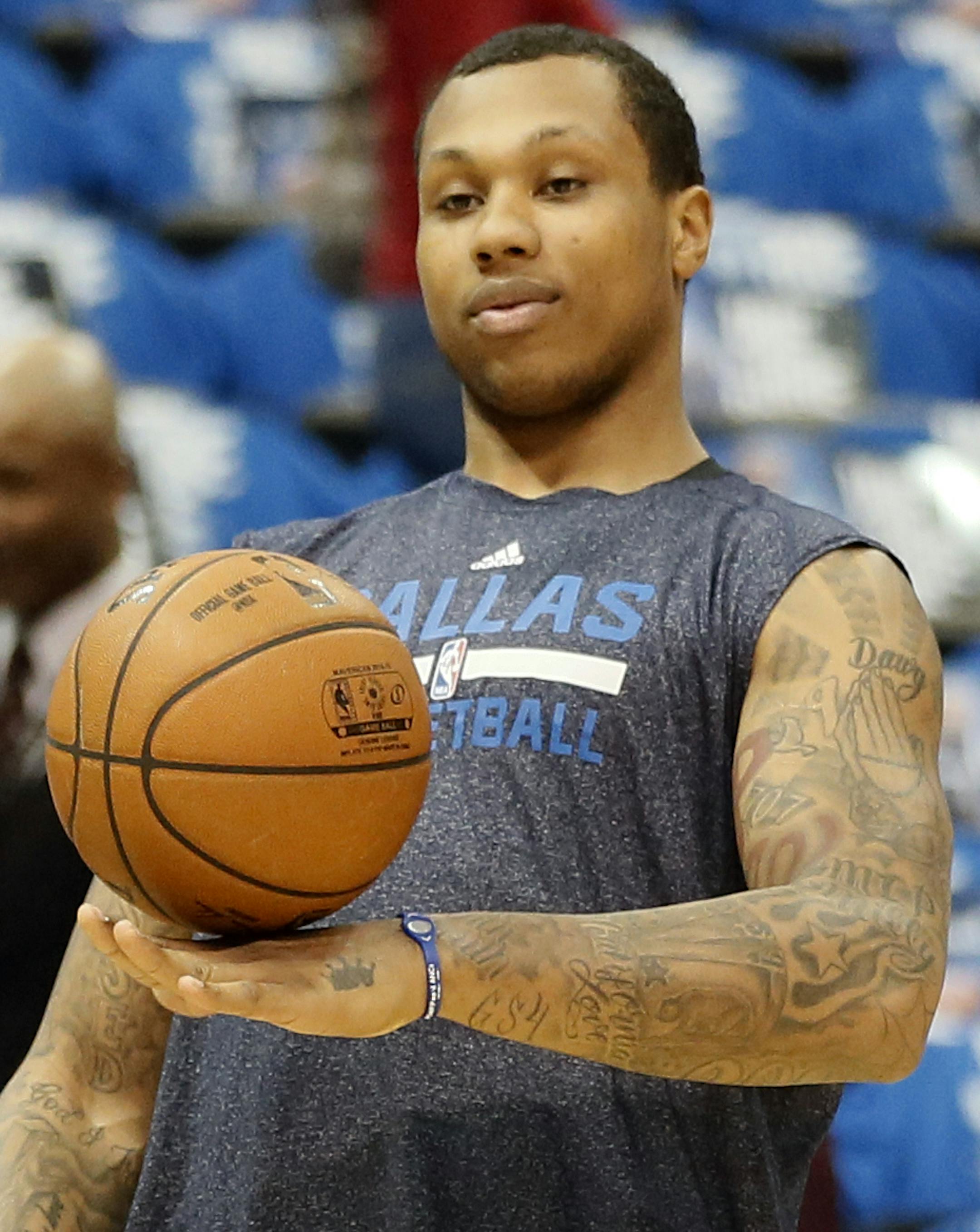 Dallas Mavericks' Greg Smith balances a ball on his hand as he takes a break from warming up before Game 4 of an NBA basketball first-round playoff series against the Houston Rockets, Sunday, April 26, 2015, in Dallas. (AP Photo/Tony Gutierrez) ORG XMIT: DNA103