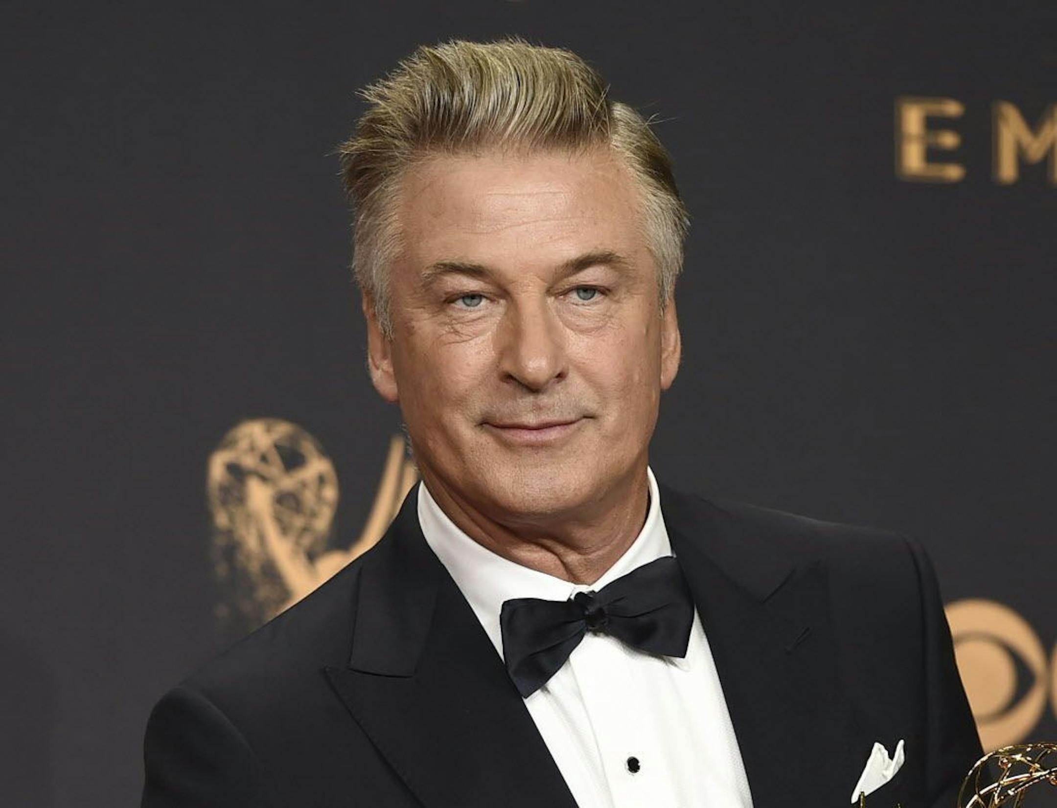 FILE - In this Sept. 17, 2017 file photo, Alec Baldwin poses in the press room with the award for outstanding supporting actor in a comedy series for "Saturday Night Live" at the 69th Primetime Emmy Awards in Los Angeles.