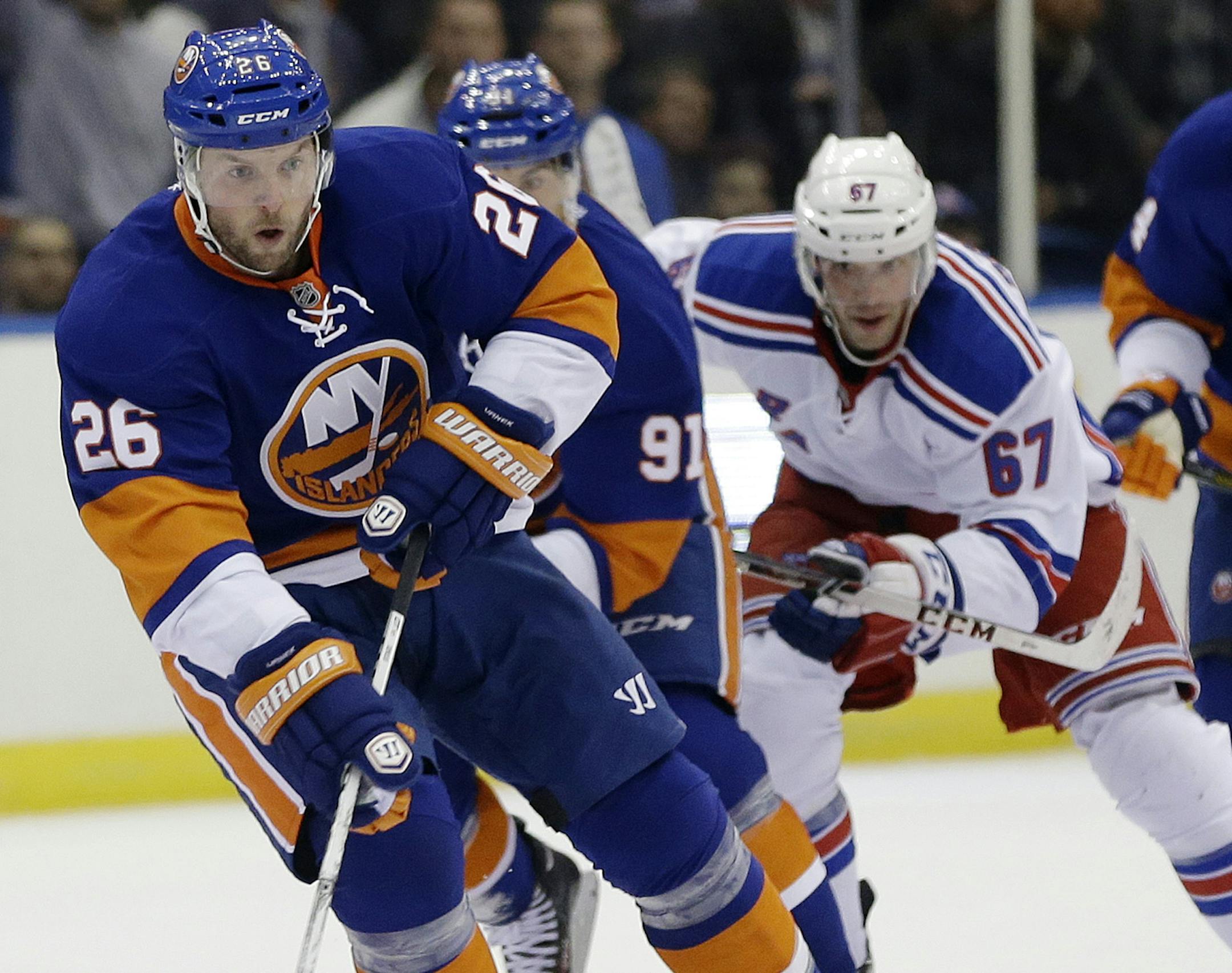 New York Islanders' Thomas Vanek (26) looks to pass during the second period of an NHL hockey game against the New York Rangers Tuesday, Oct. 29, 2013, in Uniondale, N.Y. (AP Photo/Frank Franklin II)
