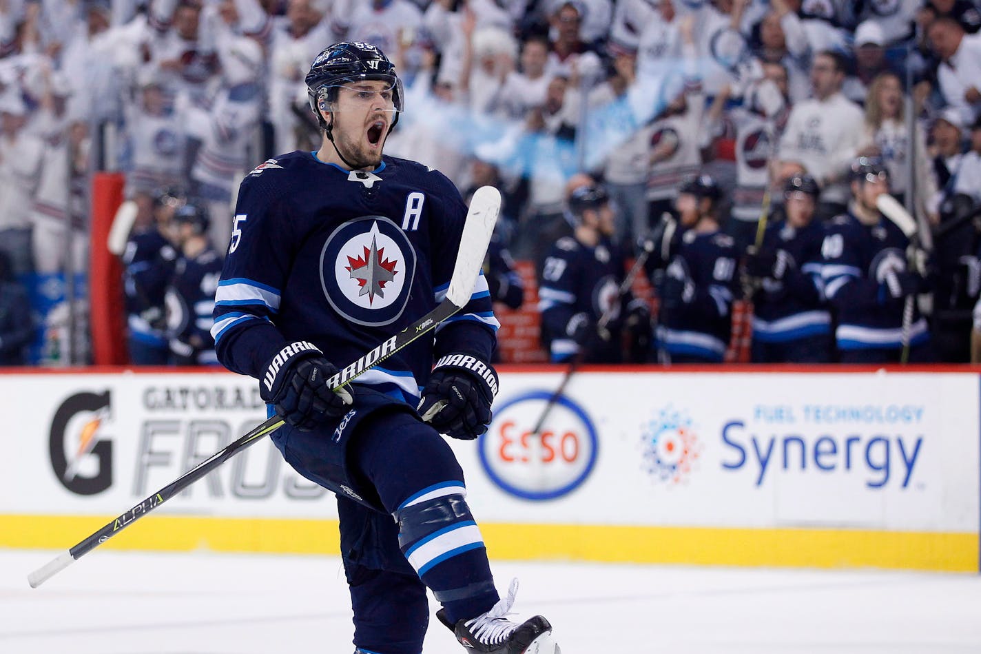 Winnipeg Jets' Mark Scheifele celebrates his goal against the Minnesota Wild during the second period of Game 1 in an NHL hockey first-round playoff series Wednesday, April 11, 2018, in Winnipeg, Manitoba. (John Woods/The Canadian Press via AP)