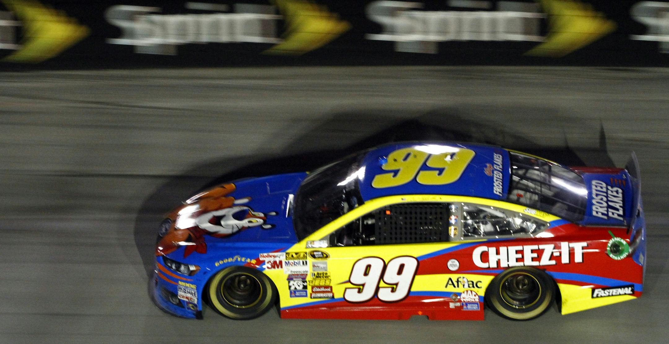 Driver Carl Edwards (99) makes his way through turn three during the NASCAR Sprint Cup series auto race at Bristol Motor Speedway on Sunday, March 16, 2014, in Bristol, Tenn. Edwards won the race. (AP Photo/Wade Payne)