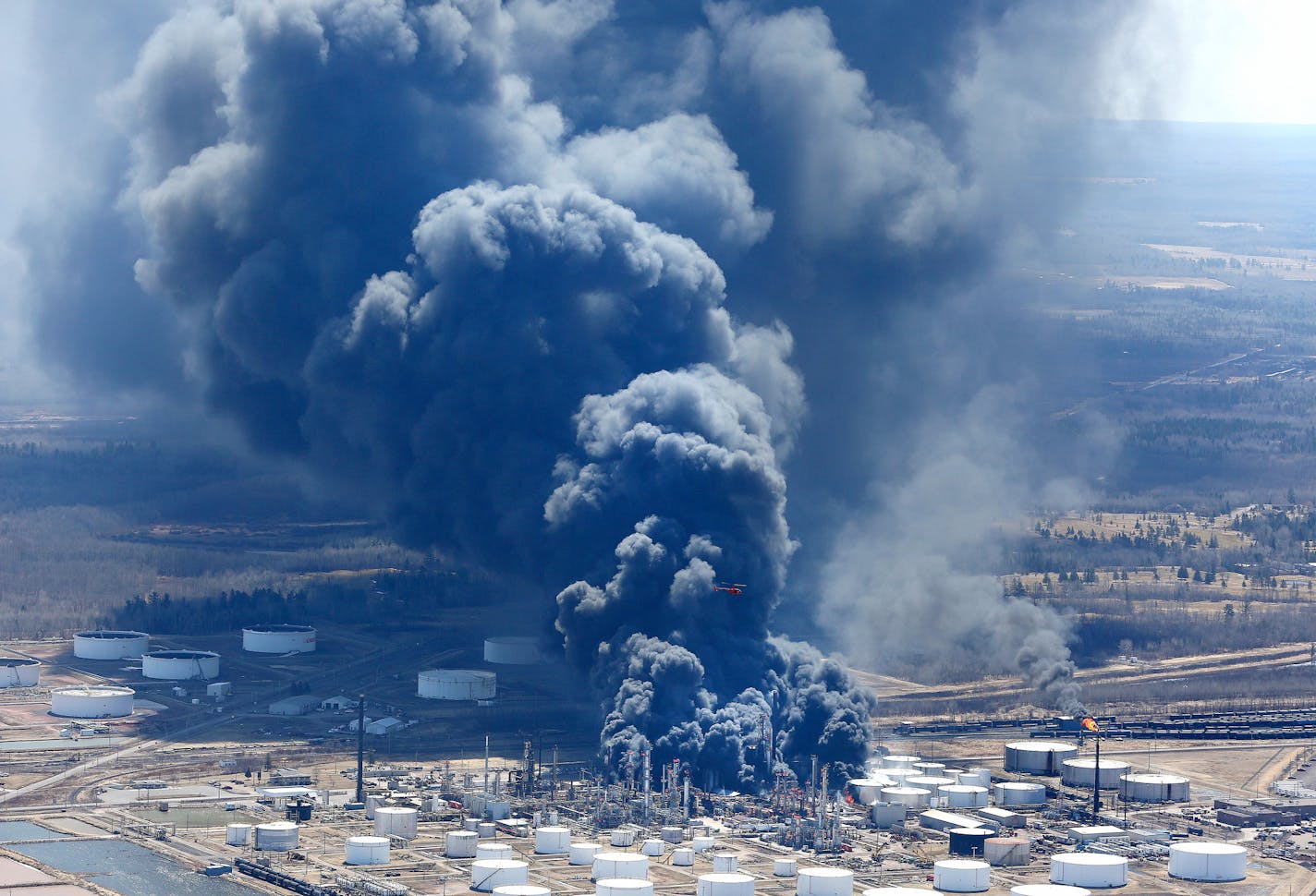 The Husky Energy refinery in Superior, Wis, burns after an explosion in April 2018. Husky has gotten permission to rebuild and is expected to fully reopen in early 2021.