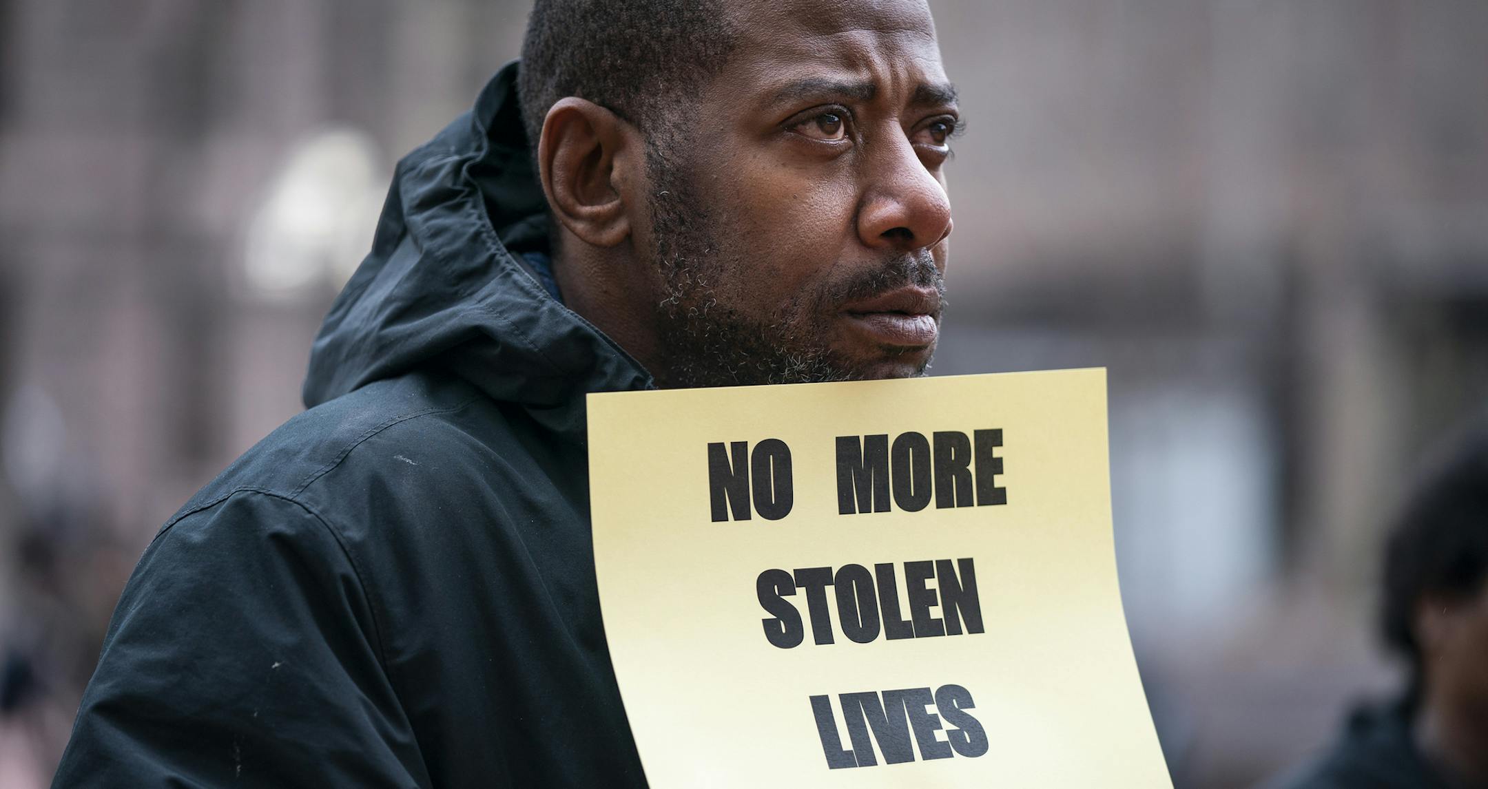 John Thompson, a friend of Philando Castile, stands with a sign during the rally. ] LEILA NAVIDI ¥ leila.navidi@startribune.com BACKGROUND INFORMATION: A "Rally To Demand Justice For All Lives Stolen By Police" held at the Government Center in downtown Minneapolis on Wednesday, May 1, 2019.