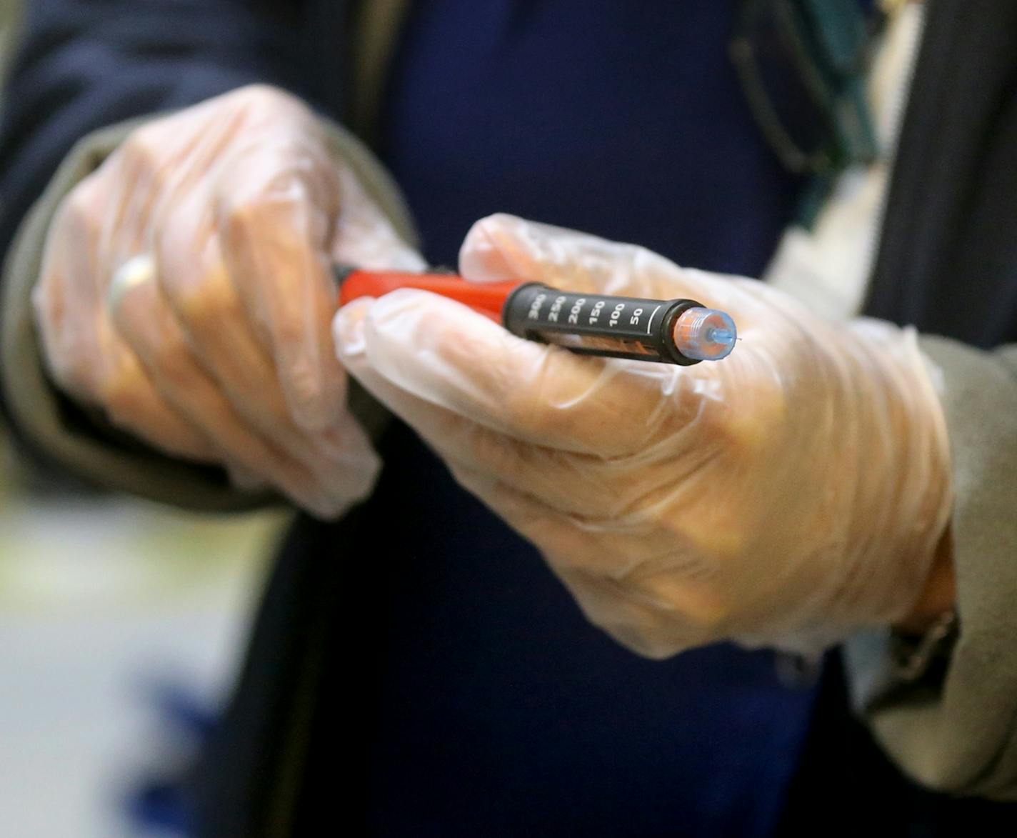 Jolie Holland, a licensed school nurse in the Howard Lake-Waverly-Winstead School District in central Minnesota, prepares an insulin pen for an injection for a young student with diabetes at Winstead Elementary School on Sept. 25, 2019.