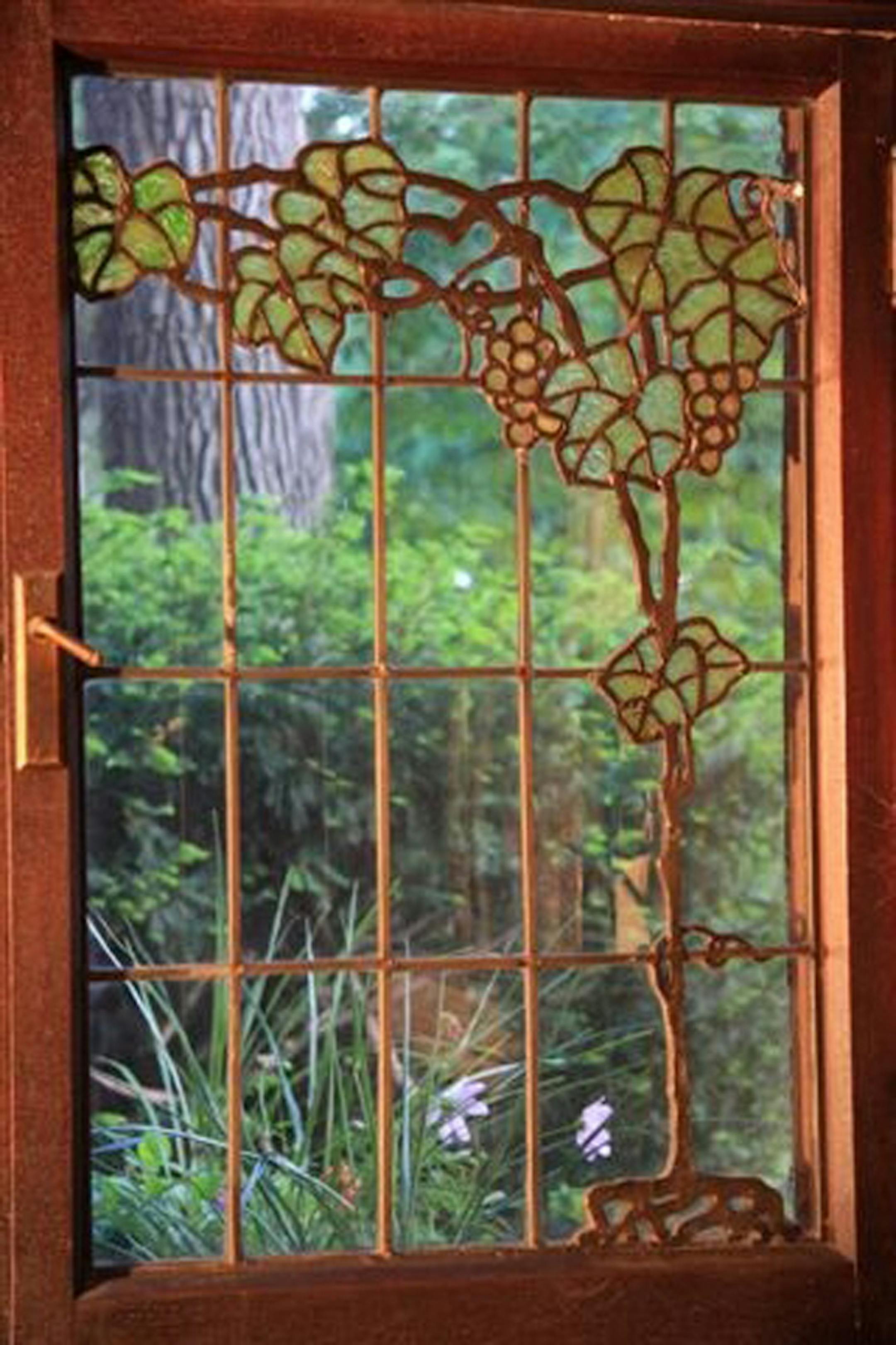 A single pane of a grapevine triptych window