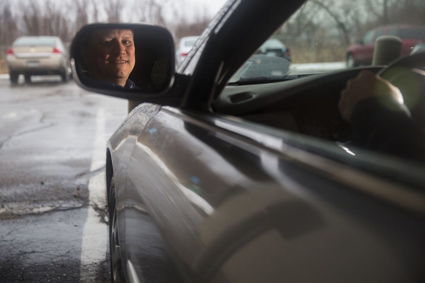 Andrew Larsen poses inside his 14-year-old car in Golden Valley on Friday, February 19, 2016.