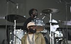 The Roots' Tariq "Black Thought" Trotter lead vocalist, foreground, with drummer Ahmir "Questlove" Thompson on the Main Stage Sunday evening at Sounds