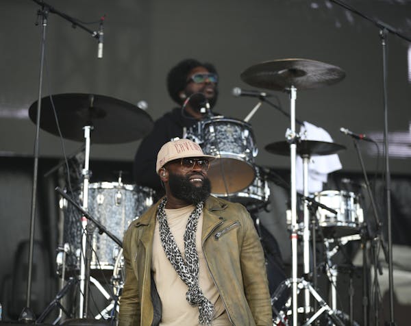 The Roots' Tariq "Black Thought" Trotter lead vocalist, foreground, with drummer Ahmir "Questlove" Thompson on the Main Stage Sunday evening at Sounds