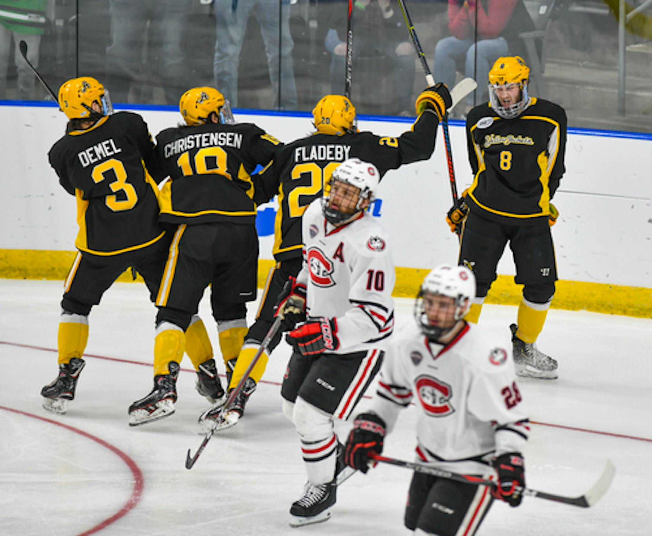 American International College players celebrate a goal during the second period of an NCAA men's Division I hockey tournament regional semifinal against St. Cloud State Friday, March 29, 2019, in Fargo, N.D. (Dave Schwarz/St. Cloud Times via AP)