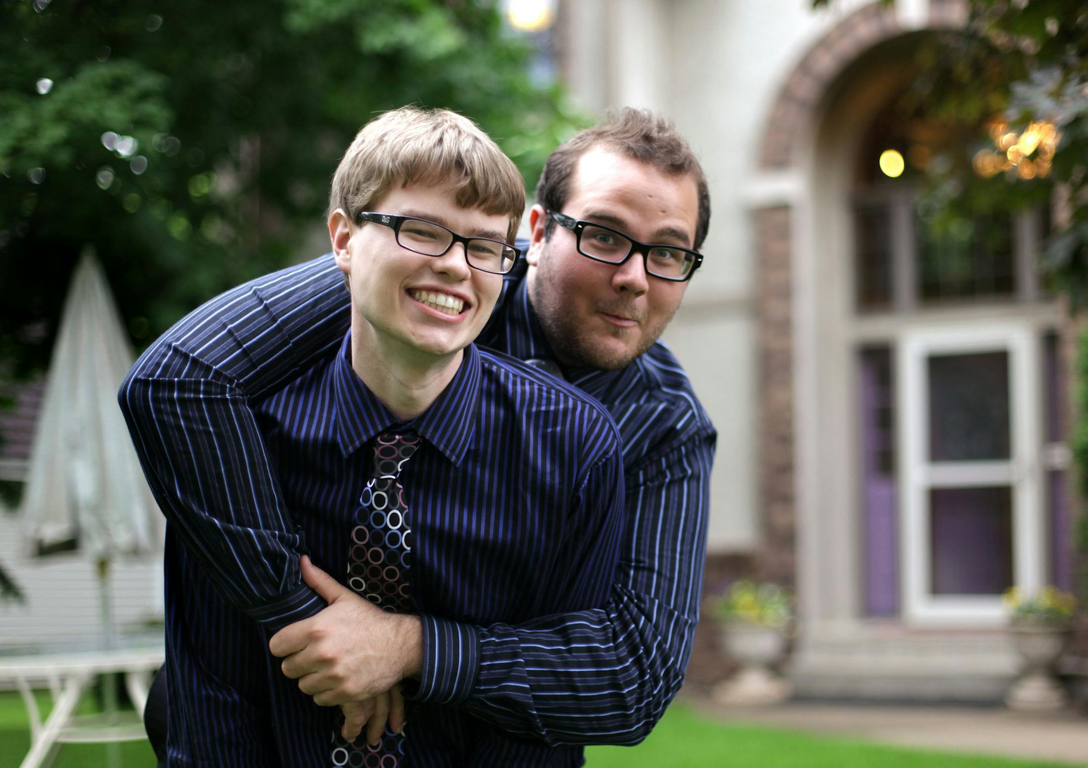 Brothers Scott and Michael Coughlin pose for a portrait outside their Burnsville home. Both are studying physics as recipients of prestigious scholarships. ] MONICA HERNDON monica.herndon@startribune.com Burnsville, MN 06/07/2014