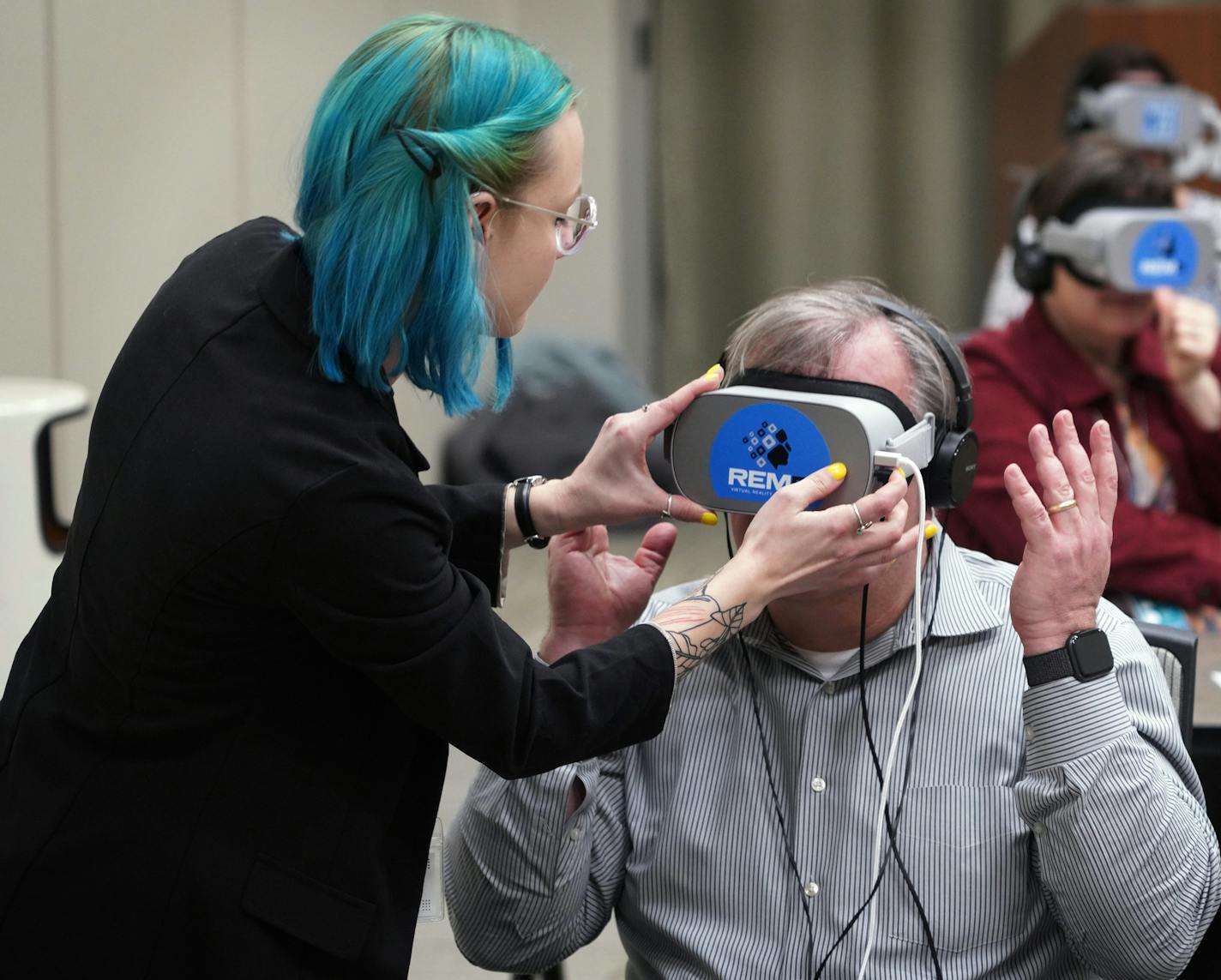 REM5, a virtual reality business in St. Louis Park, is moving beyond the entertainment aspect of VR and aiming to use it for good -- bringing the technology into classrooms, corporations, law enforcement agencies and potentially even City Hall to launch conversations about racial and gender equity and inclusion. Here, Meg Noakes of REM5, helps Cargill employees with headsets to watch the New York Times VR documentary Traveling While Black, to help spark conversations about inclusion among employ