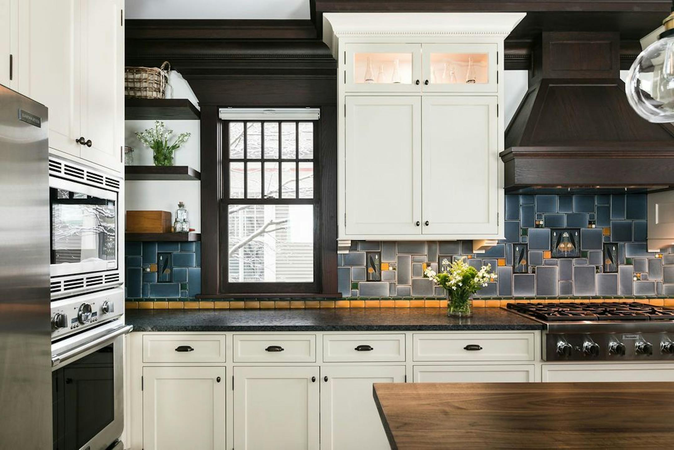 The backsplash is made of handcrafted art tile.
