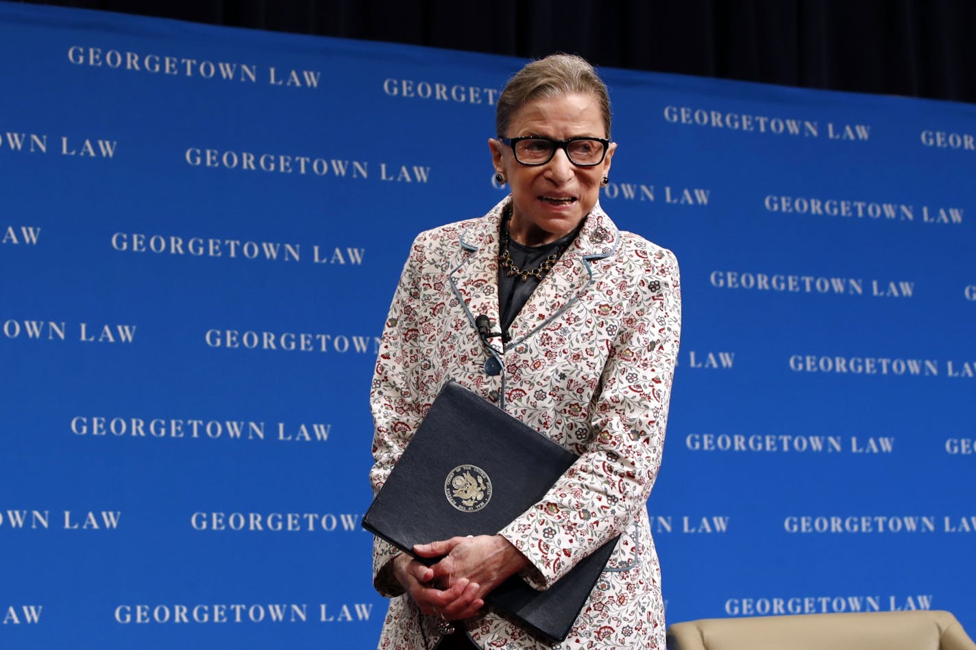 FILE - In this Sept. 26, 2018, file photo, Supreme Court Justice Ruth Bader Ginsburg leaves the stage after speaking to first-year students at Georgetown Law in Washington. The Supreme Court says Ginsburg has died of metastatic pancreatic cancer at age 87.