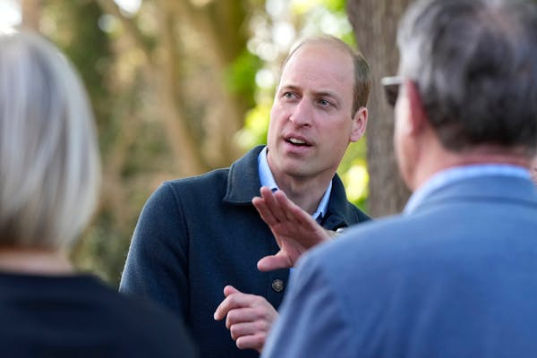 Britain's Prince William is greeted as he arrives for a visit to Surplus to Supper, in Sunbury-on-Thames, Surrey, England, Thursday, April 18, 2024. T