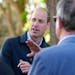 Britain's Prince William is greeted as he arrives for a visit to Surplus to Supper, in Sunbury-on-Thames, Surrey, England, Thursday, April 18, 2024. T