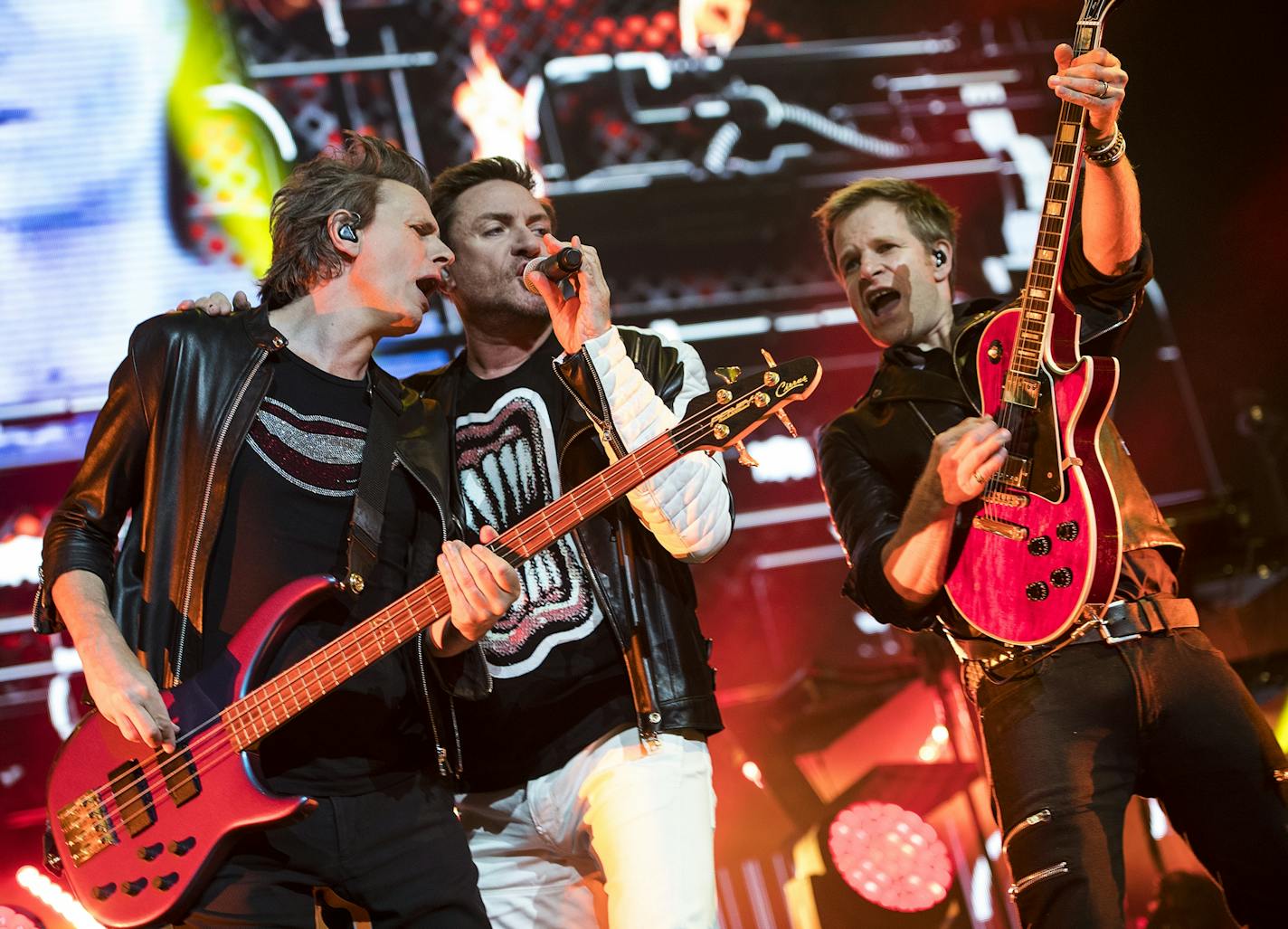 From left, John Taylor, Simon Le Bon and Dominic Brown performed with the rest of Duran Duran at the Xcel Energy Center on Saturday night.