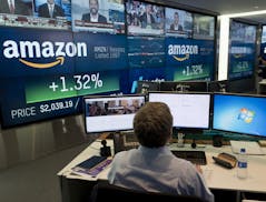 FILE- In this Sept. 4, 2018, file photo a Nasdaq employee monitors market activity in New York. Amazon.com Inc. reports earnings Thursday, Oct. 25. (A