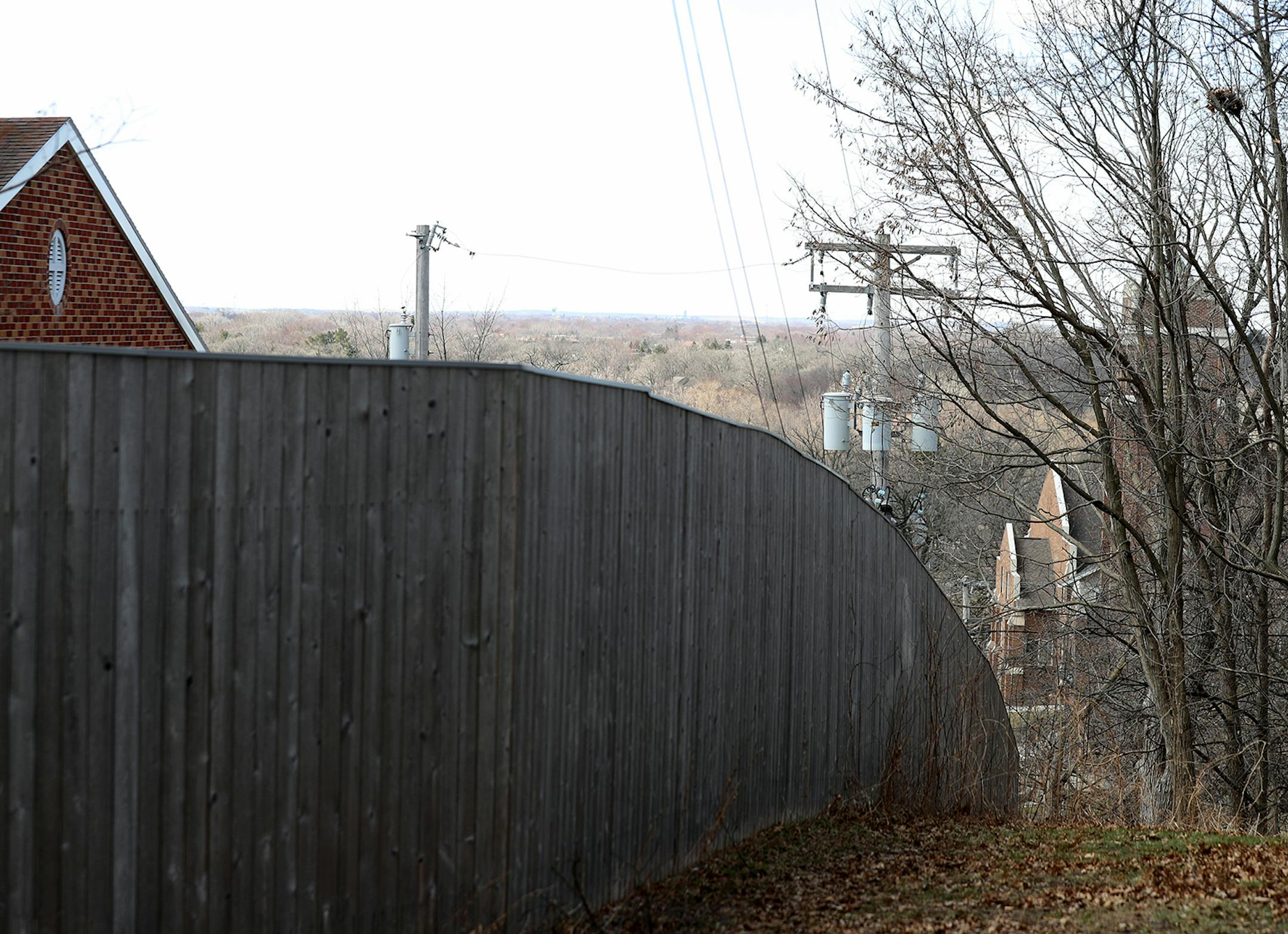 A large wooden fence rings the Poor Clare Nuns of St. Clare's Monastery Thursday, April 16, 2020, in Sauk Rapids, MN. Poor Clare nuns of St. Clare's Monastery nuns met with journalists in the monastery's parlor, the one room where outsiders have partial access to the nuns in a room divided by a metal lattice with a folding wooden divider.