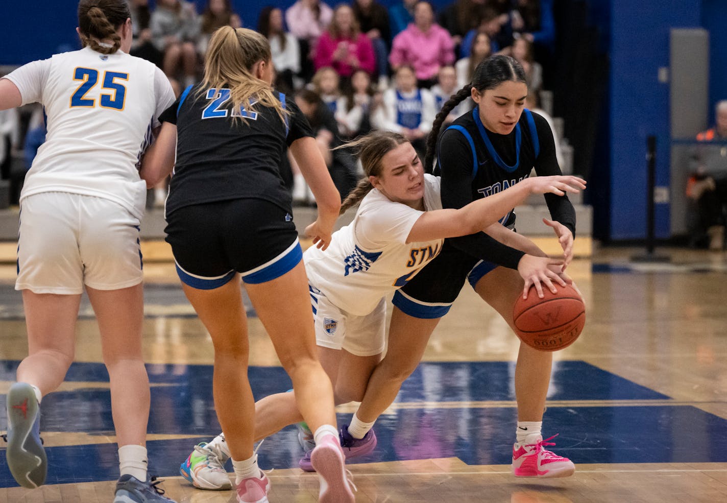 St. Michael-Albertville's Kaylie Cox (2) tries to steal the ball from St. Michael-Albertville's Lanelle Wright (10) in the second half. Minnetonka High School hosted St. Michael-Albertville, both undefeated Class 4A girls basketball teams, on Friday, Jan. 12, 2024 in Minnetonka, Minn. Minnetonka won 63-54. ] RENEE JONES SCHNEIDER • renee.jones@startribune.com