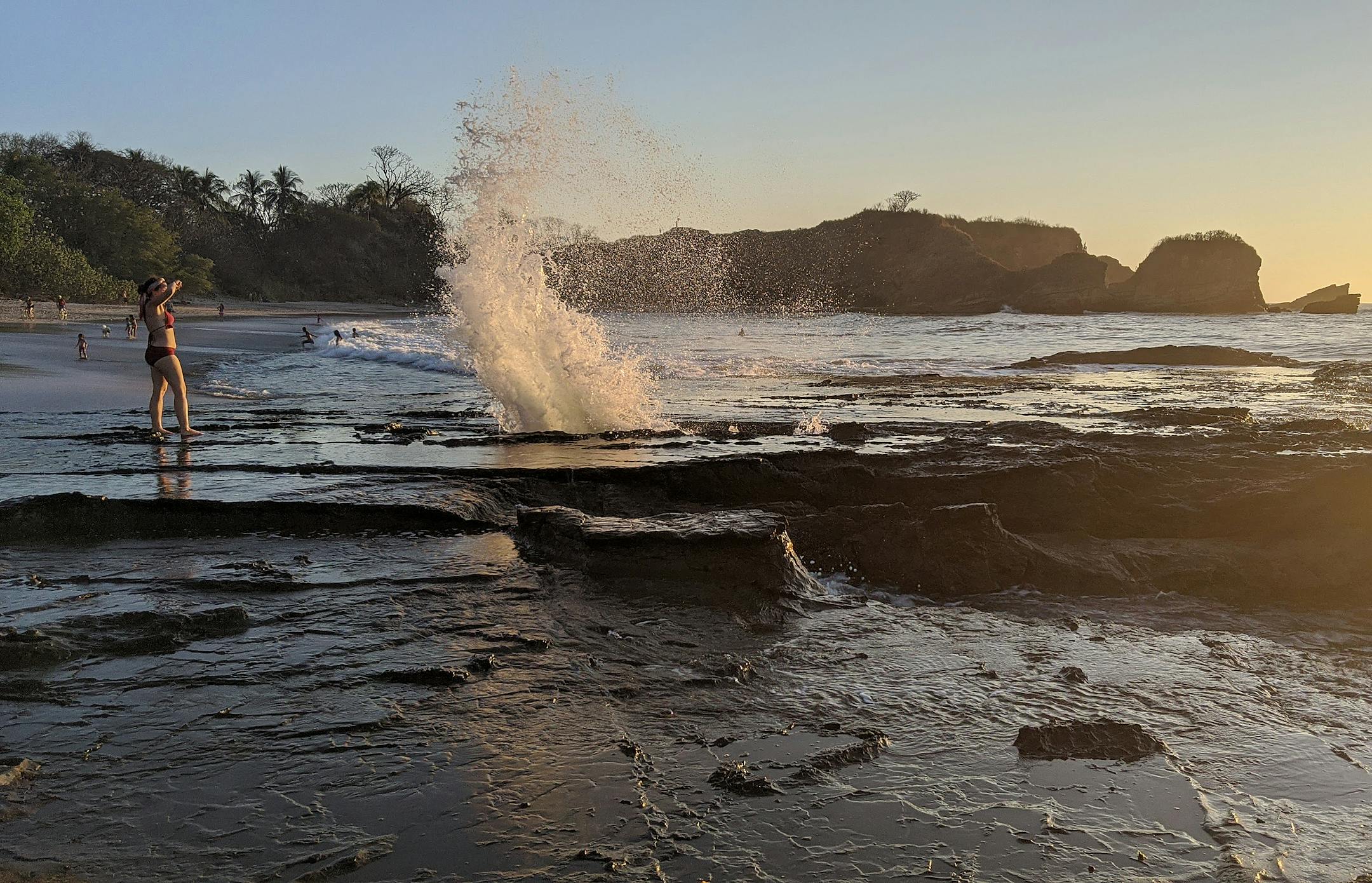 Pacific waves burst though a tidal blowhole at Playa Pelada in Nosara, Costa Rica.