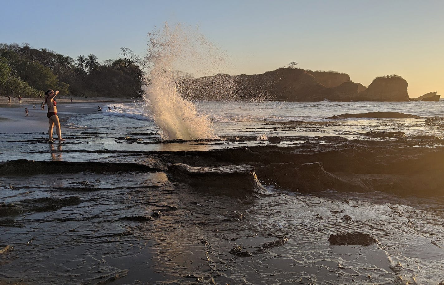 Pacific waves burst though a tidal blowhole at Playa Pelada in Nosara, Costa Rica.