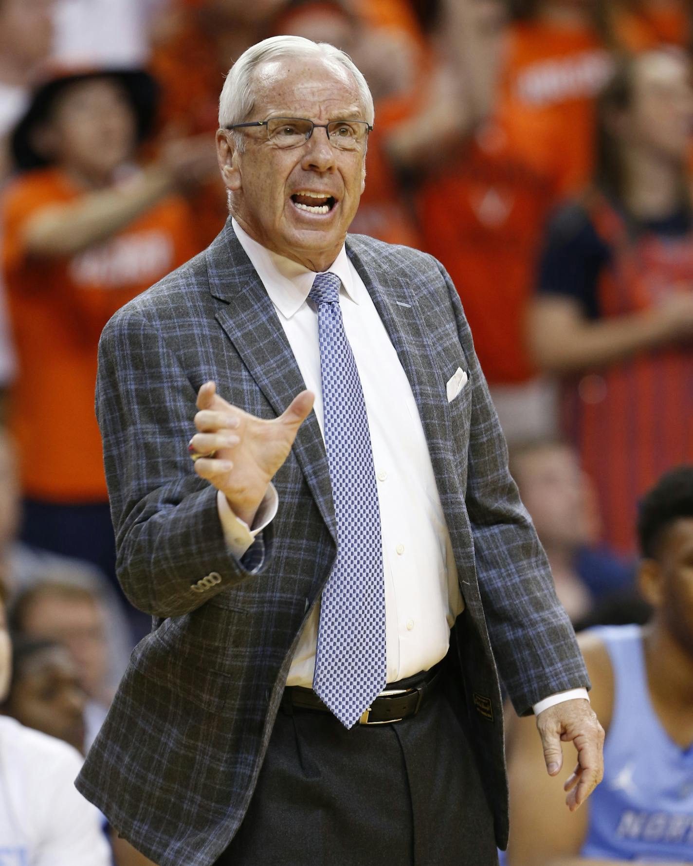 North Carolina head coach Roy Williams directs his team during the first half of an NCAA college basketball game against Virginia in Charlottesville, Va., Monday, Feb. 27, 2017. (AP Photo/Steve Helber)