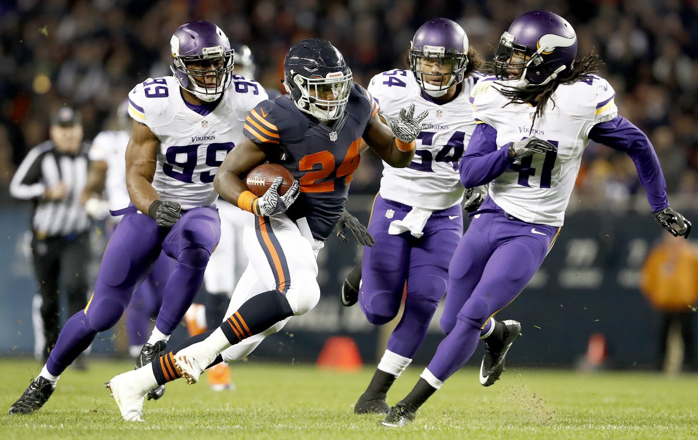 Jordan Howard (24) was chased by Danielle Hunter (99) Eric Kendricks (54) and Anthony Harris (41) during a run after catching a shovel pass in the second quarter. ] CARLOS GONZALEZ cgonzalez@startribune.com - October 31, 2016, Chicago, IL, Soldier Field, NFL, Minnesota Vikings vs. Chicago Bears