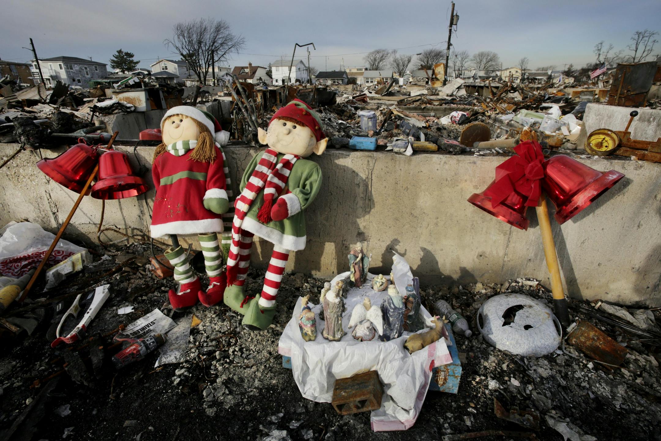 A creche and Christmas decorations are left by a homeowner along a foundation wall and the ruins of a house in the Breezy Point section of New York, Thursday, Dec. 20, 2012. More than 100 homes were burned to the ground in an inferno that swept through the beachfront neighborhood during Superstorm Sandy on Oct. 29, 2012.