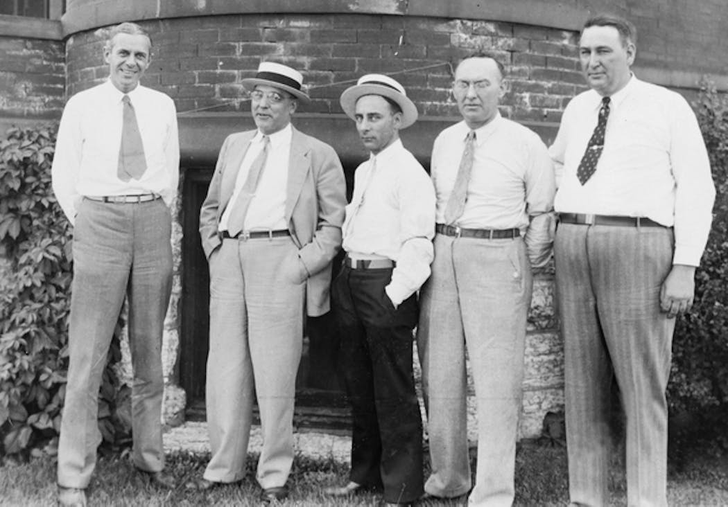 Kidnapping victim William A. Hamm Jr., left, stands alongside a colleague and several members of the St. Paul Police Department in 1933. At right is Detective Thomas A. Brown, who was later found to have aided and abetted the Hamm kidnapping.