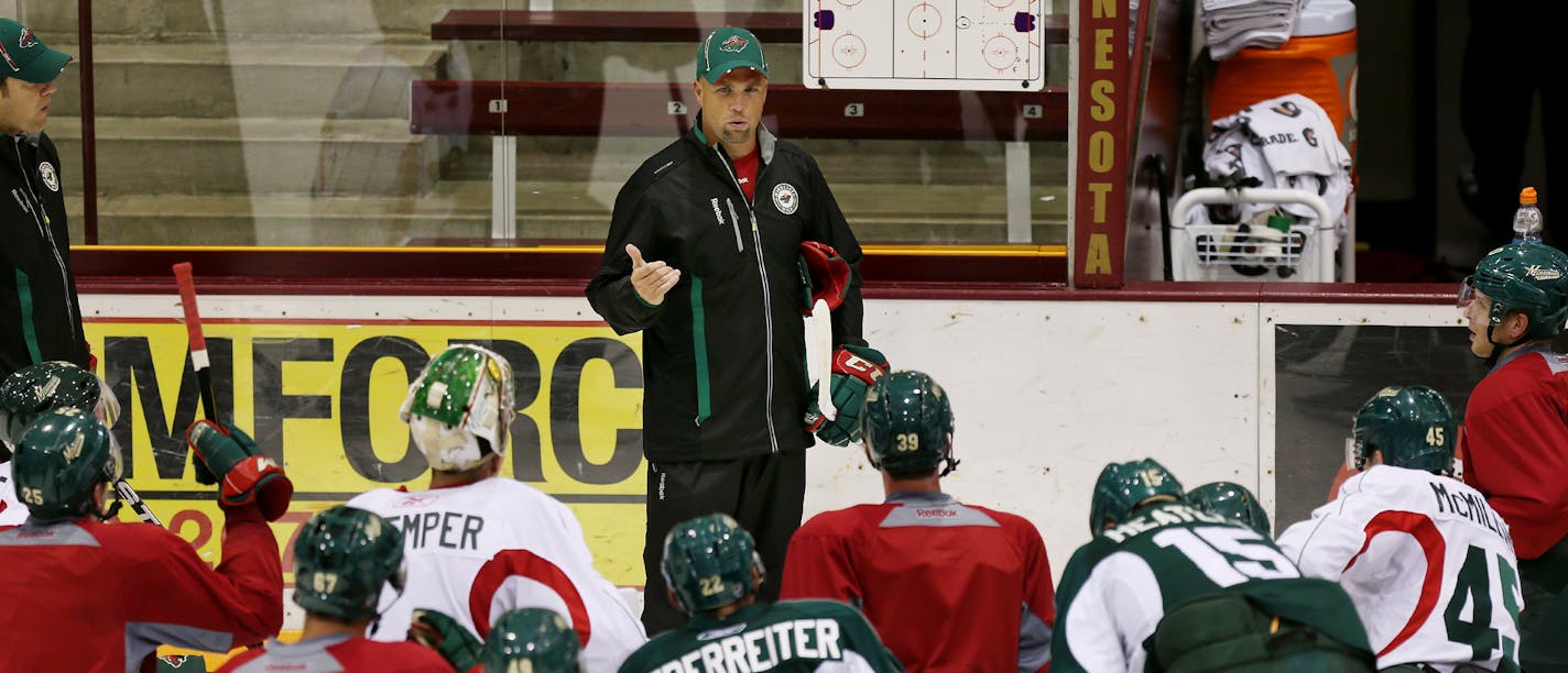 Wild coach Mike Yeo talks to the team during practice at Ridder Arena on the U of M campus. Minneapolis, MN. September 12, 2013. ] JOELKOYAMA&#x201a;&#xc4;&#xa2;joel koyama@startribune The Wild opens practice. They will have two sessions at Ridder Arena. We don't need to be there at the start, just get some interesting "first day" action. There are also some specific players we'd like to get, if possible: Marco Scandella, Matt Dumba, Justin Fontaine, Dany Heatley and Kyle Brodziak. (if we DON'T