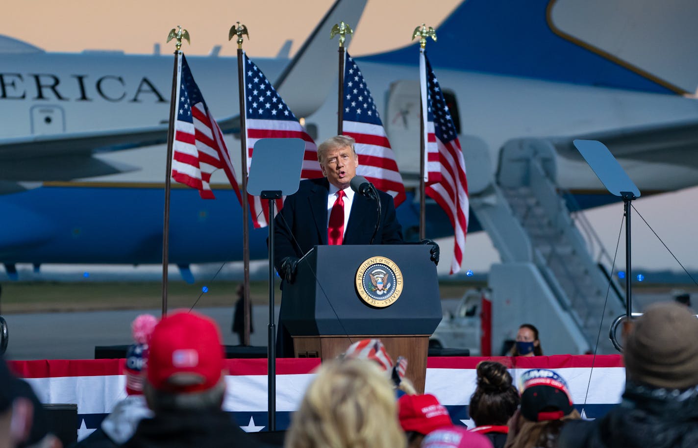 Donald Trump rallied supporters Friday at the Rochester airport. Trump's tone was more subdued than past rallies